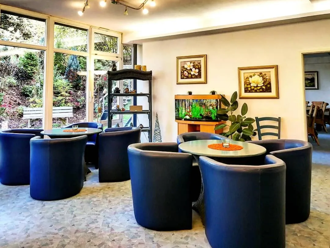 Communal lounge/ TV room in Ferienhotel Schwarzwälder Hof