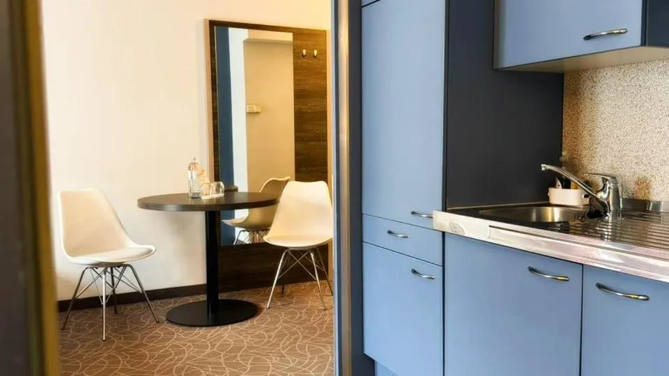 Kitchen or kitchenette in 24hours Apartment Hotel