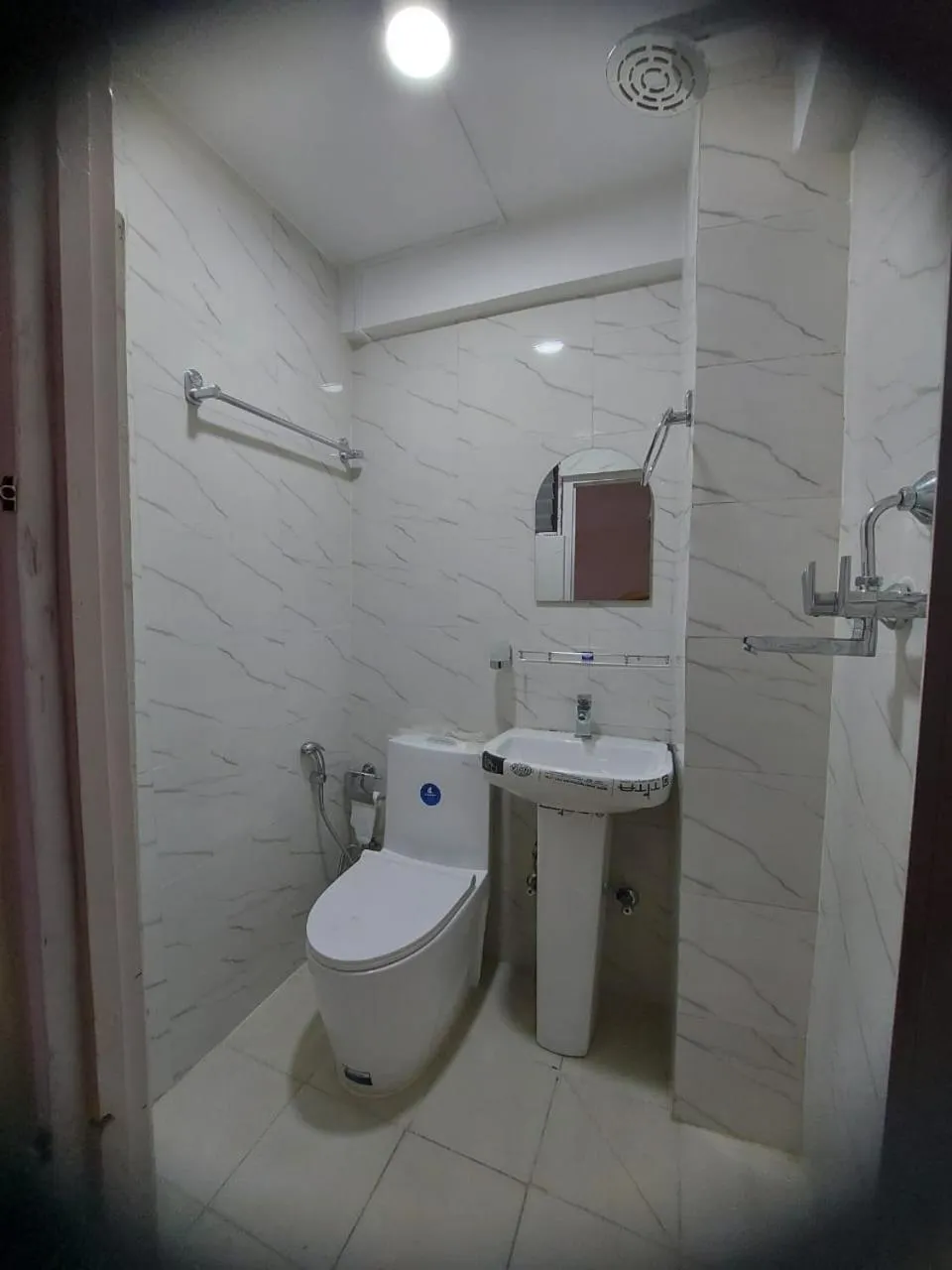 Bathroom in Om Bramha Hotel