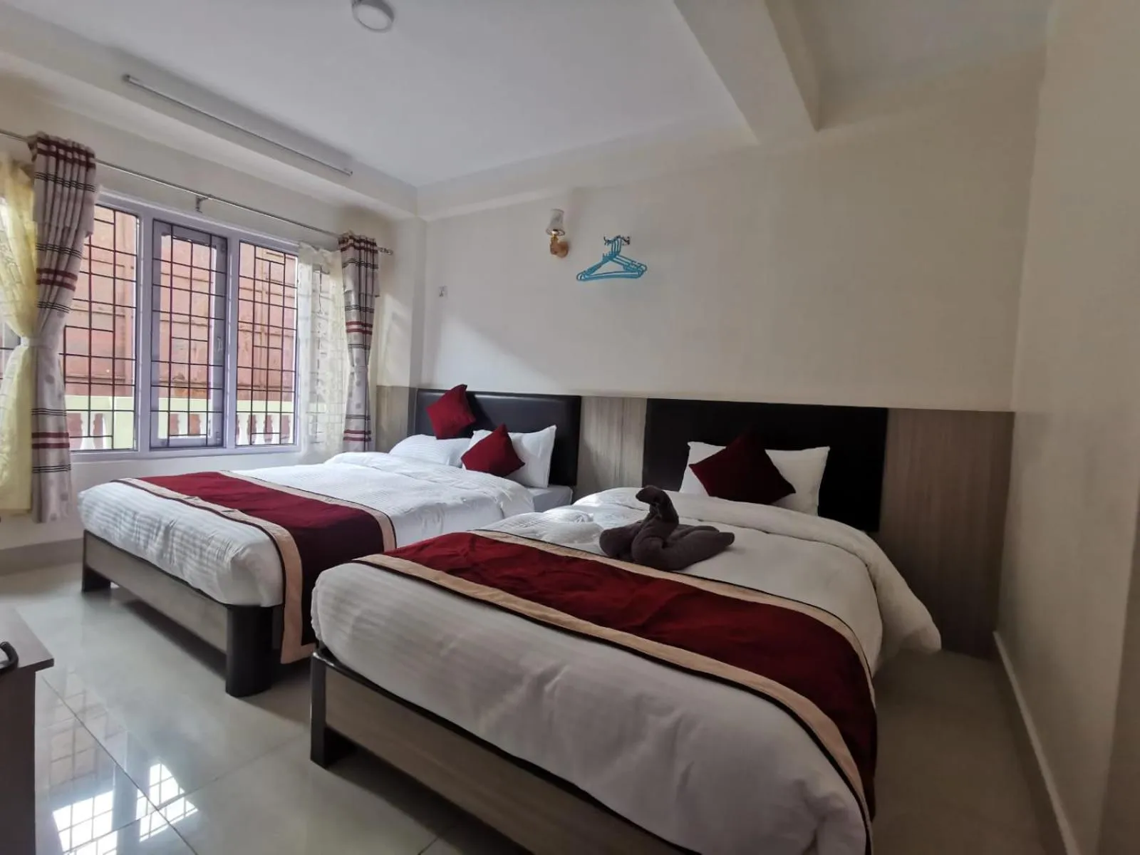 Photo of the whole room, Bed in Om Bramha Hotel