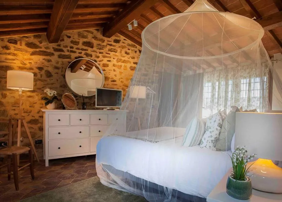 Bed in Tuscan Escape Luxury 2 bedroom apartment with pool