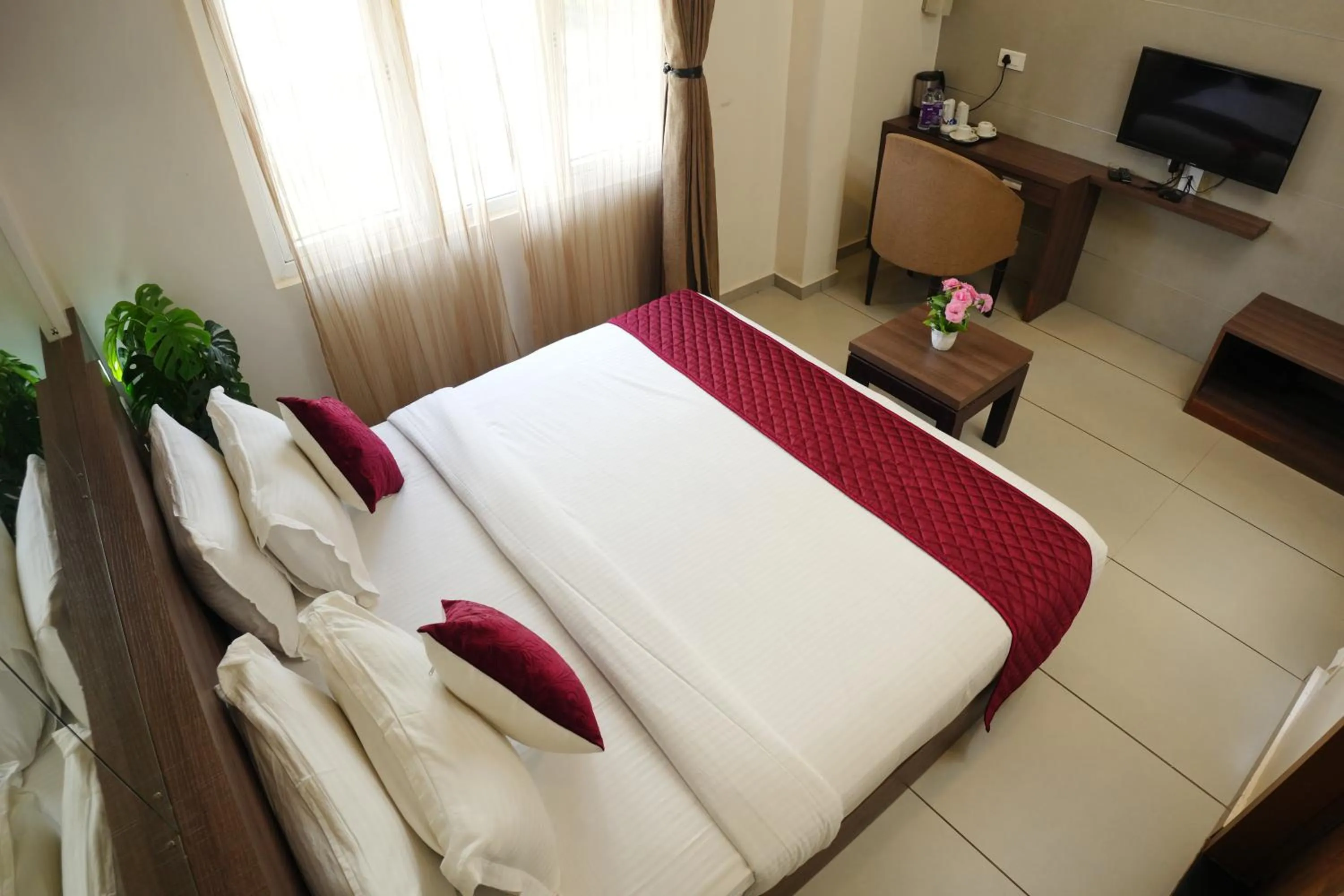 Photo of the whole room, Bed in Hotel Palmyra Grand Inn - Kochi