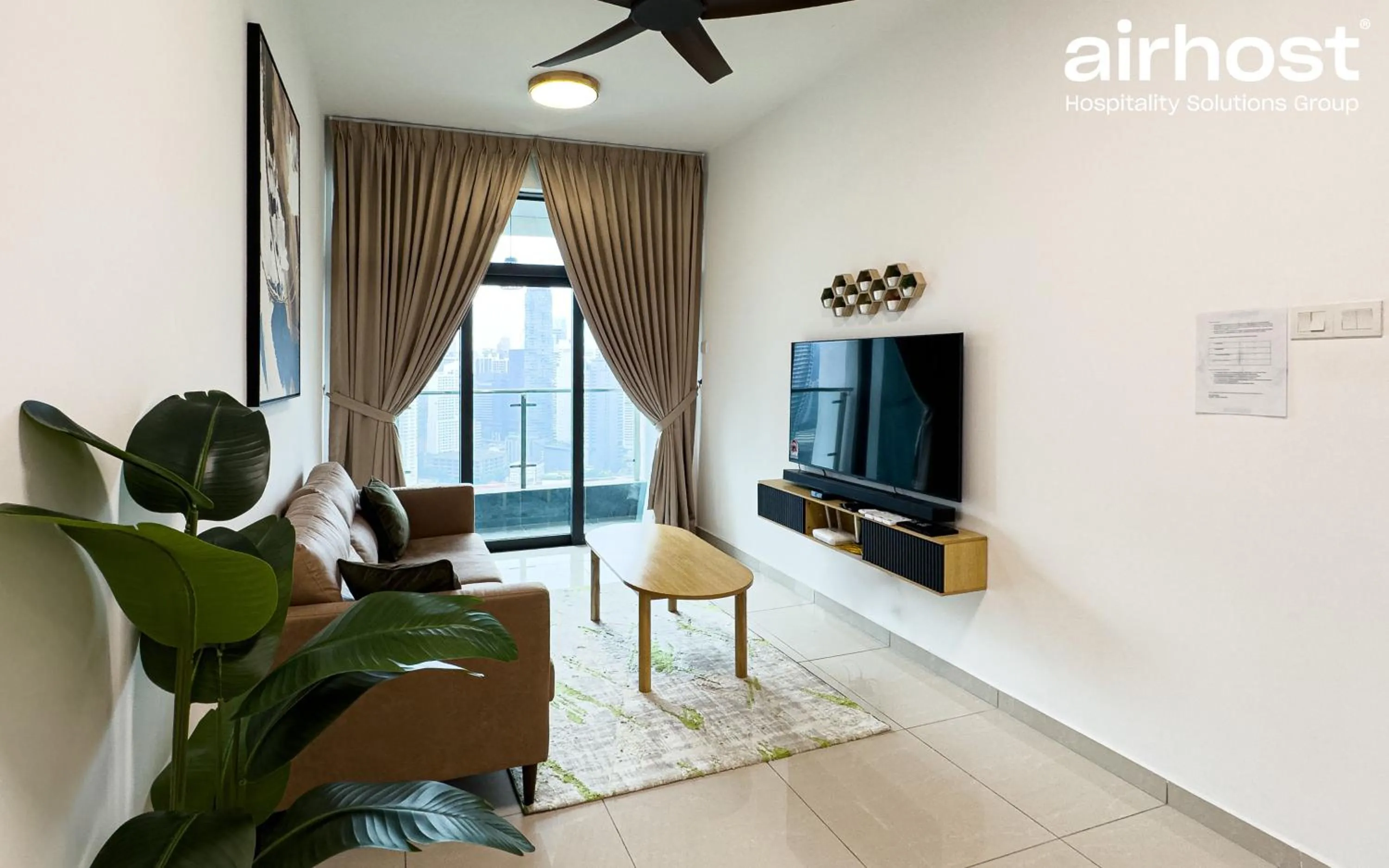 Communal lounge/ TV room in Legasi Kampung Baru by Airhost