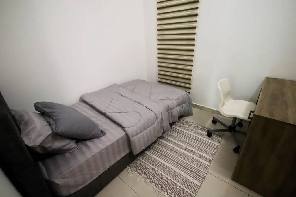 Bedroom in Legasi Kampung Baru by Airhost