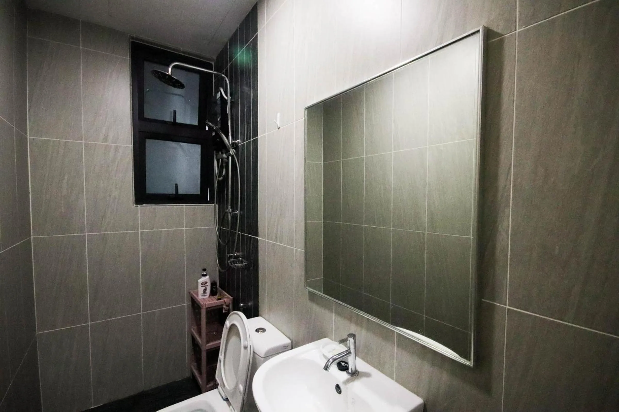 Bathroom in Legasi Kampung Baru by Airhost