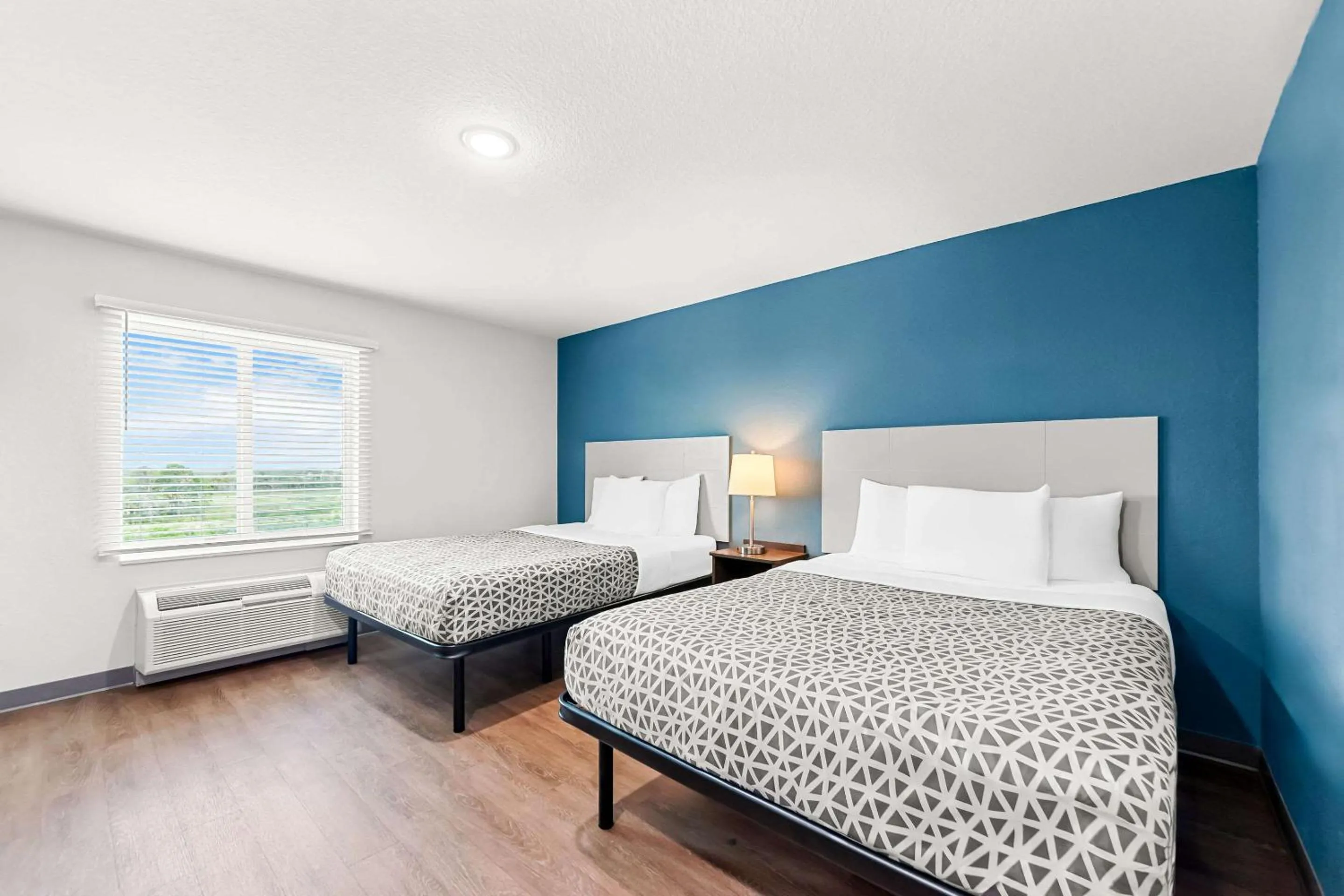 Bedroom, Bed in WoodSpring Suites Hudson Port Richey