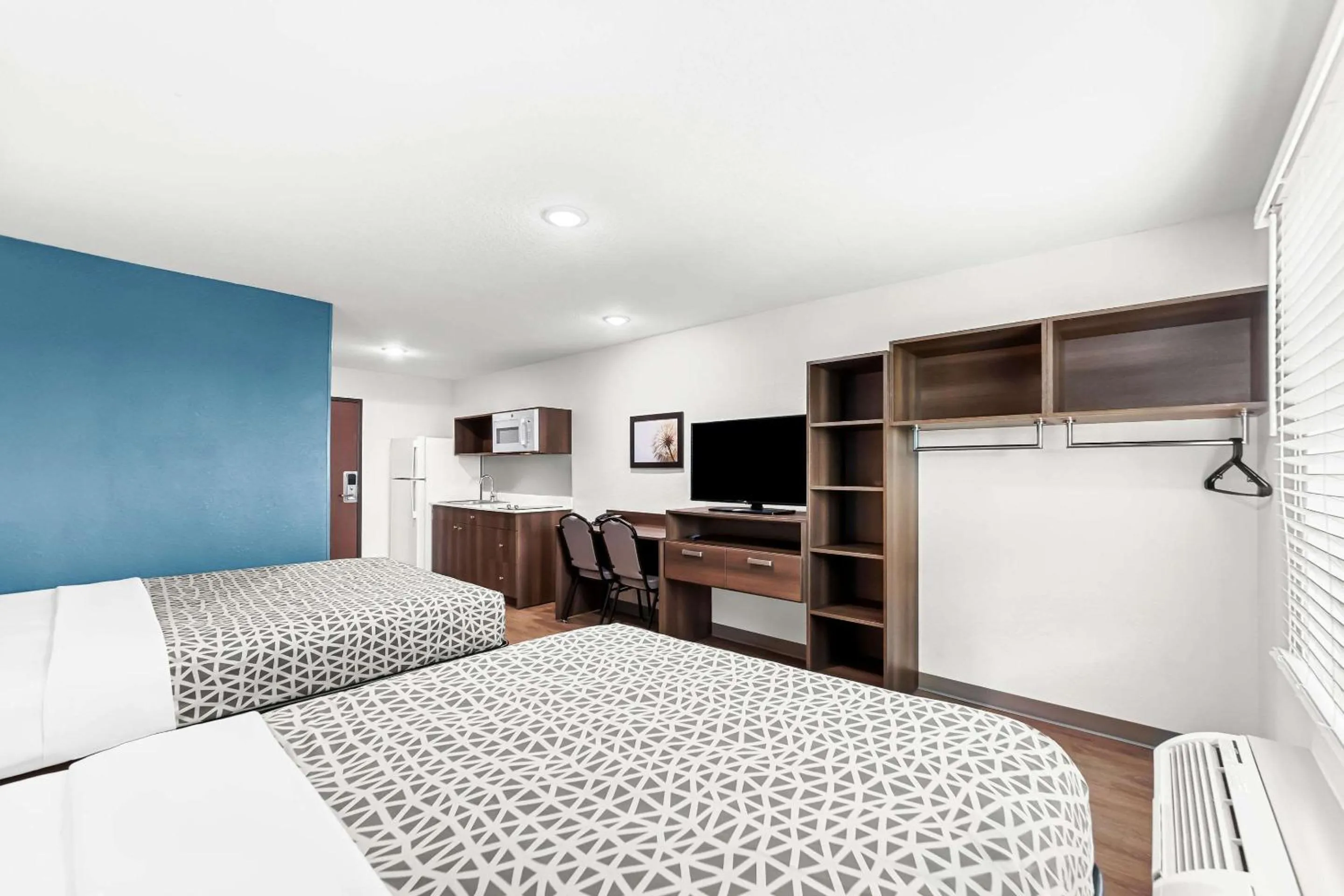 Bedroom, Bed in WoodSpring Suites Hudson Port Richey