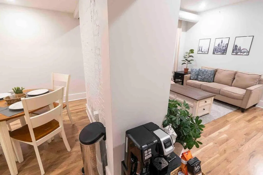 Living room in Spacious 1 bed 1 bath Downtown OTR condo minutes walk to the Reds Bengals stadium & more!