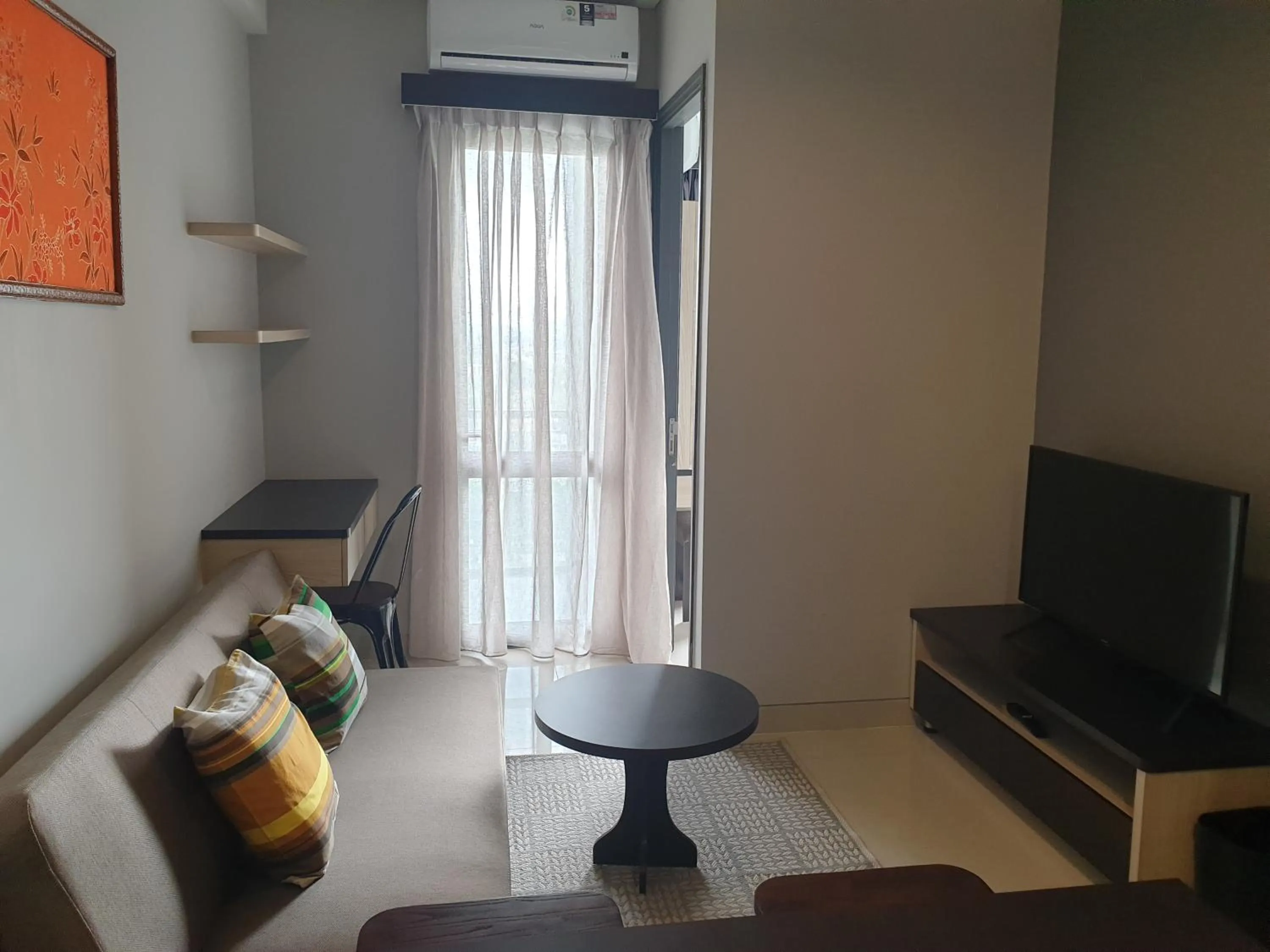 Living room in CozyHomes at One Residence Batam