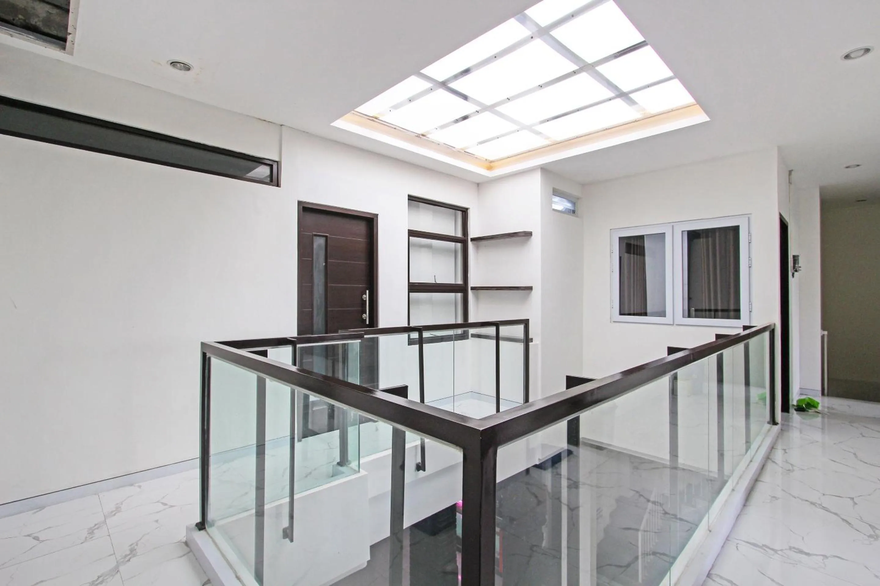 Lobby or reception in Capital O 91665 D'prof Exclusive Guesthouse