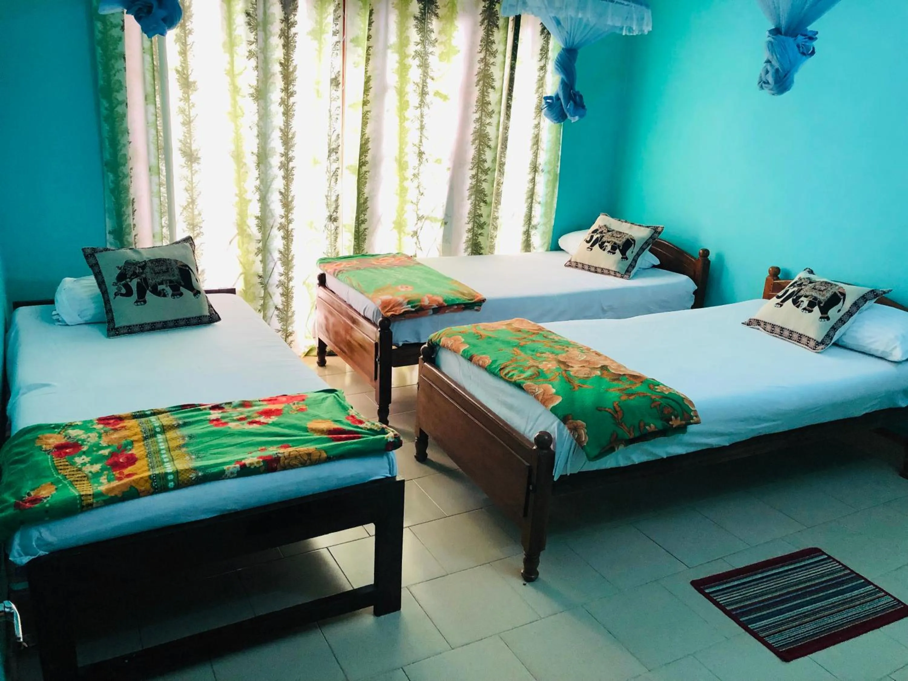 Bed in Araliya Holiday Bungalow