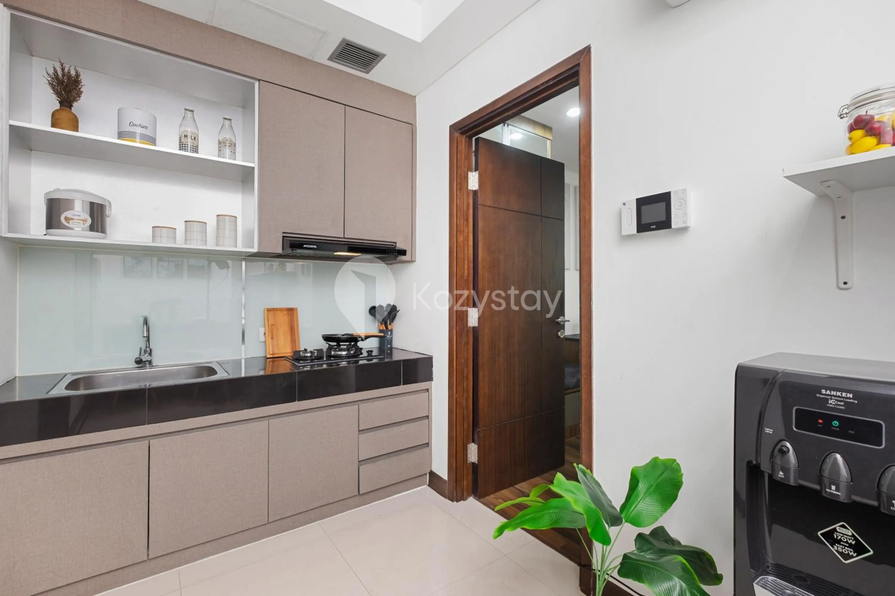 Kitchen or kitchenette in Orchid by Kozystay - Kebon Jeruk