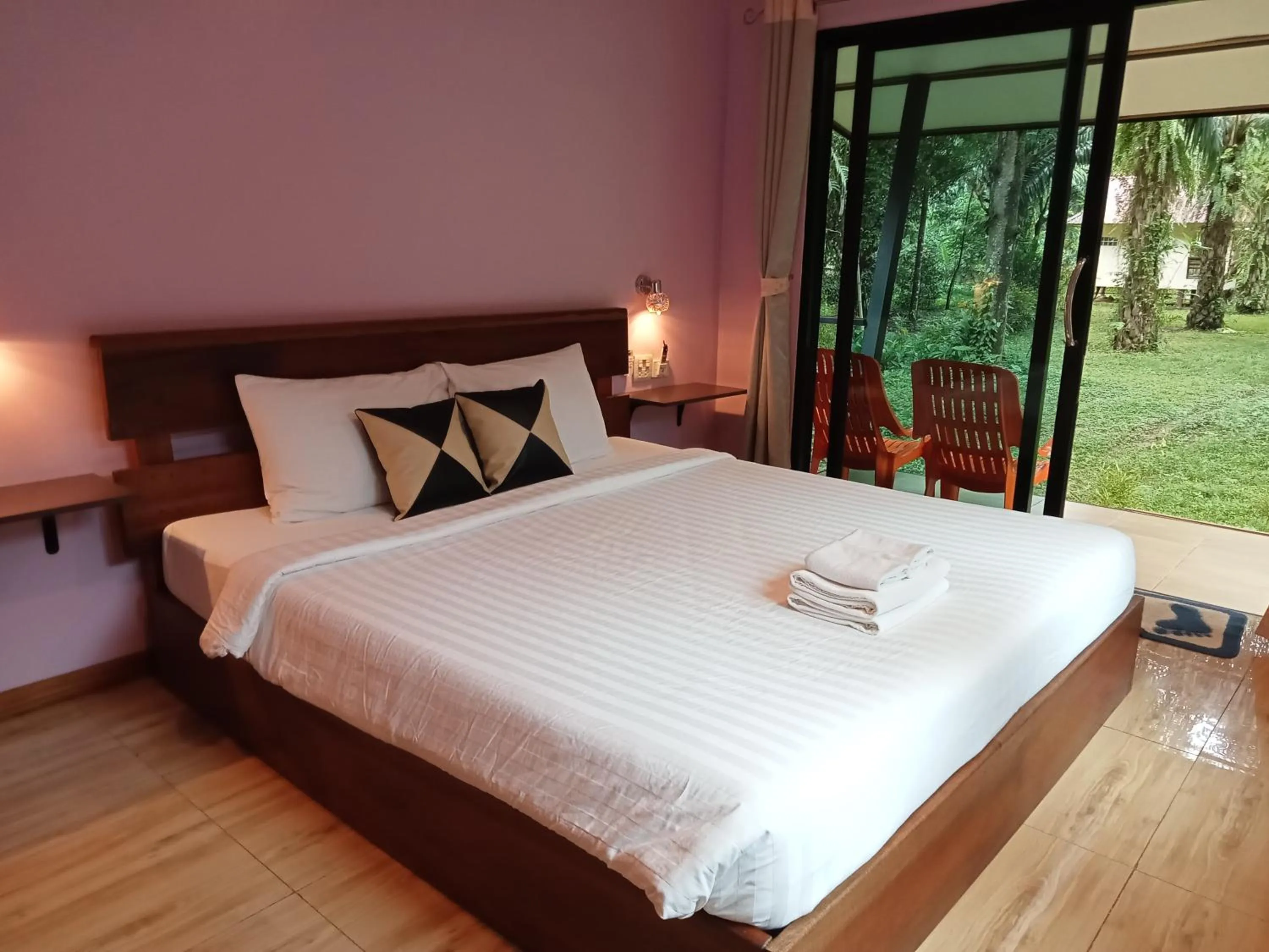 Bed in Khao Sok Palm Garden Resort