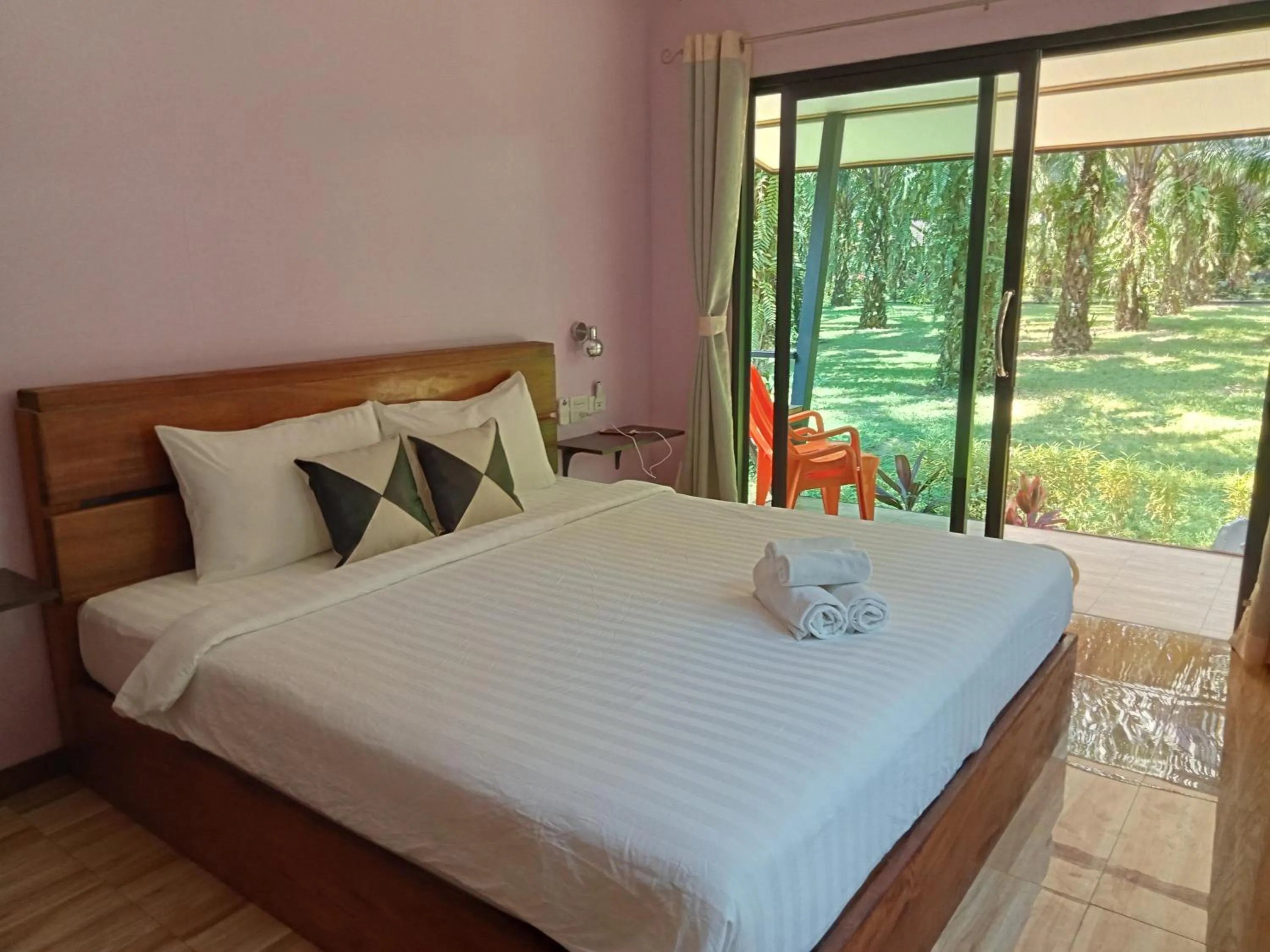 Bed in Khao Sok Palm Garden Resort