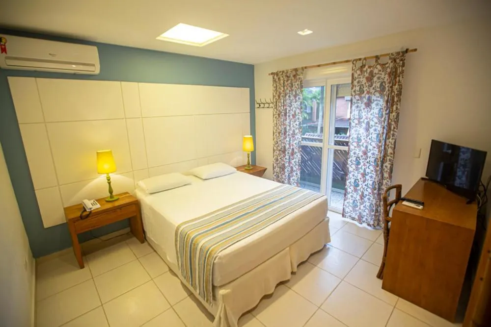 Photo of the whole room, Bed in Juquehy Praia Hotel