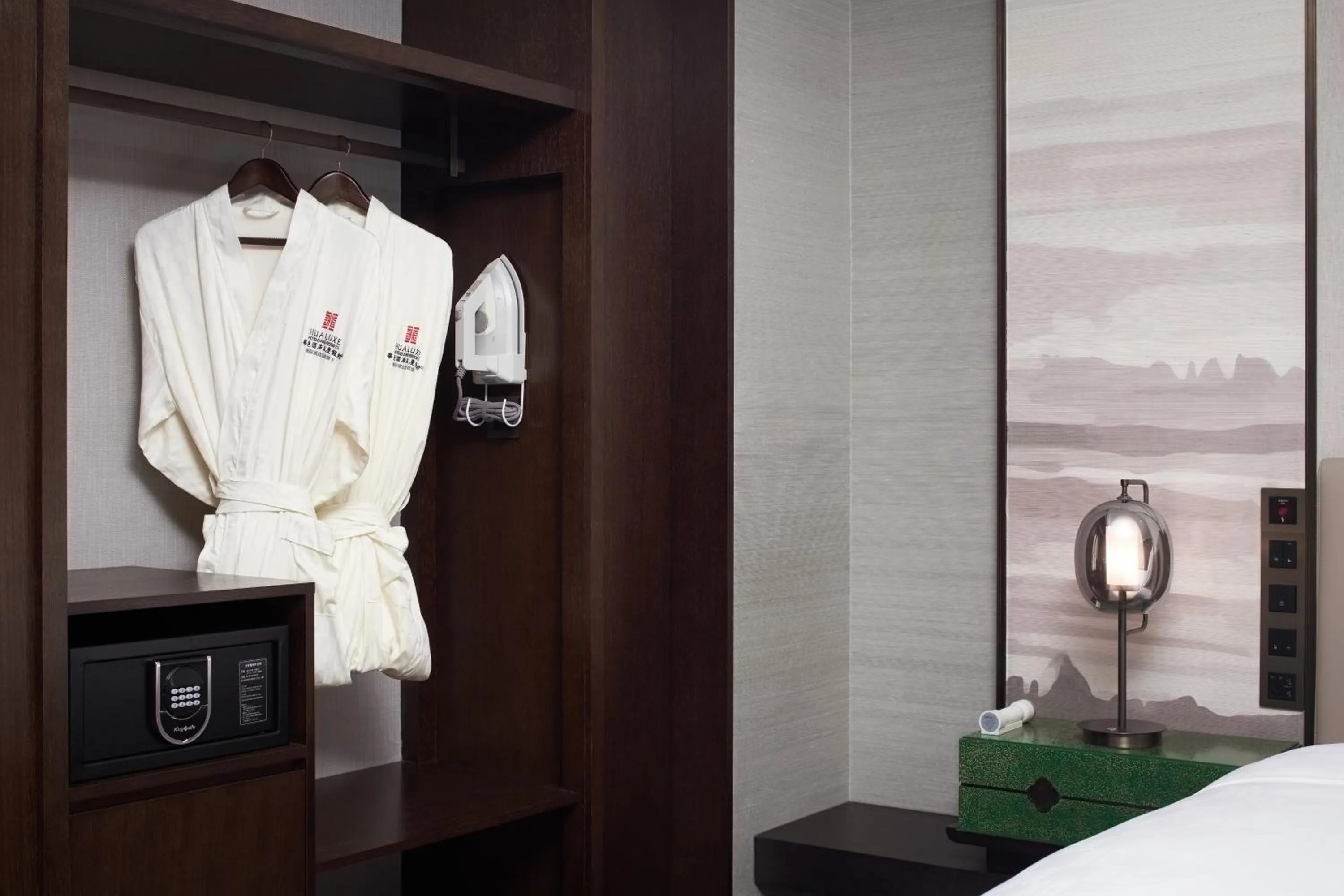 wardrobe in HUALUXE Kunshan Huaqiao, an IHG Hotel
