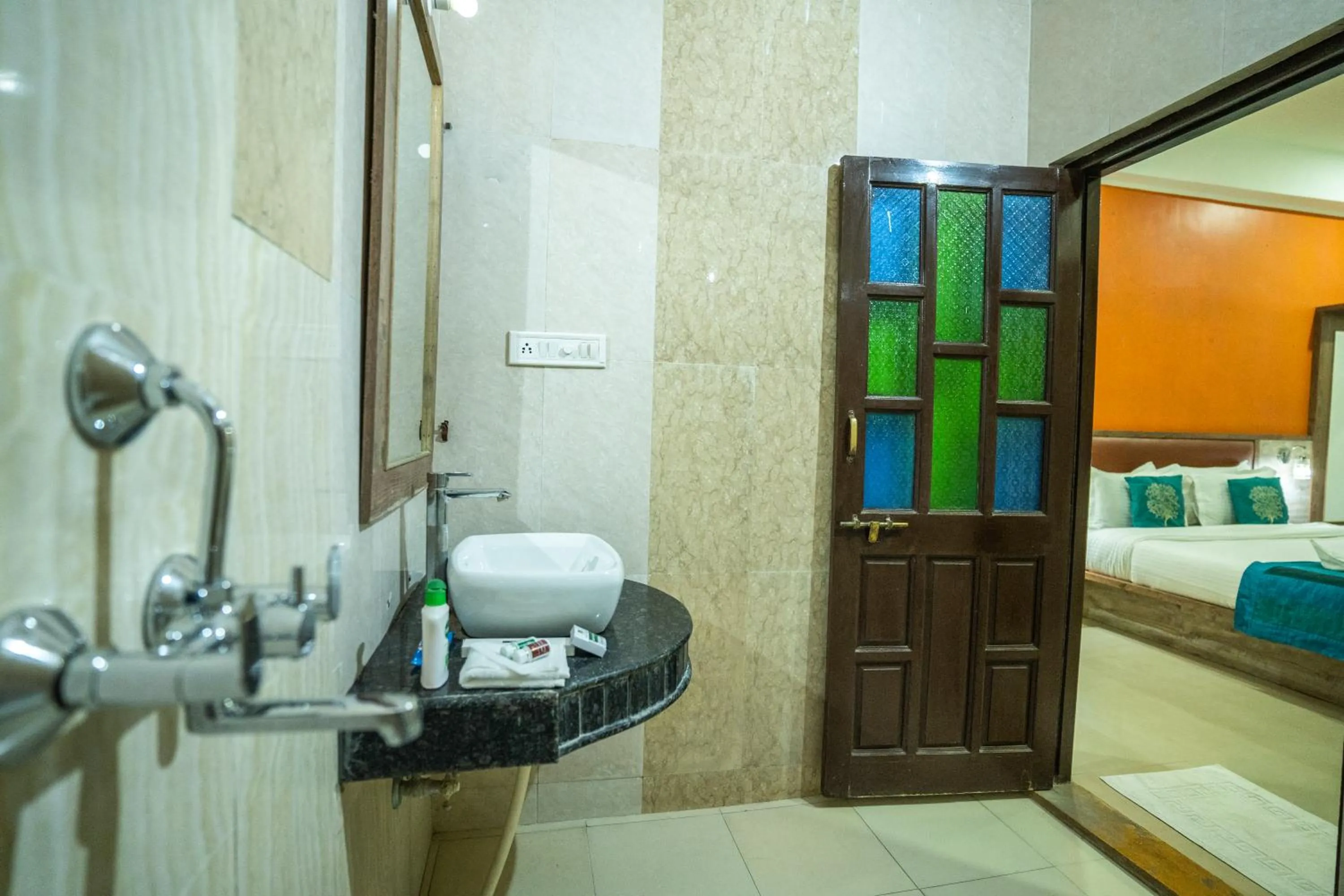 Bed in Hotel Marina Mahal with Swimming Pool