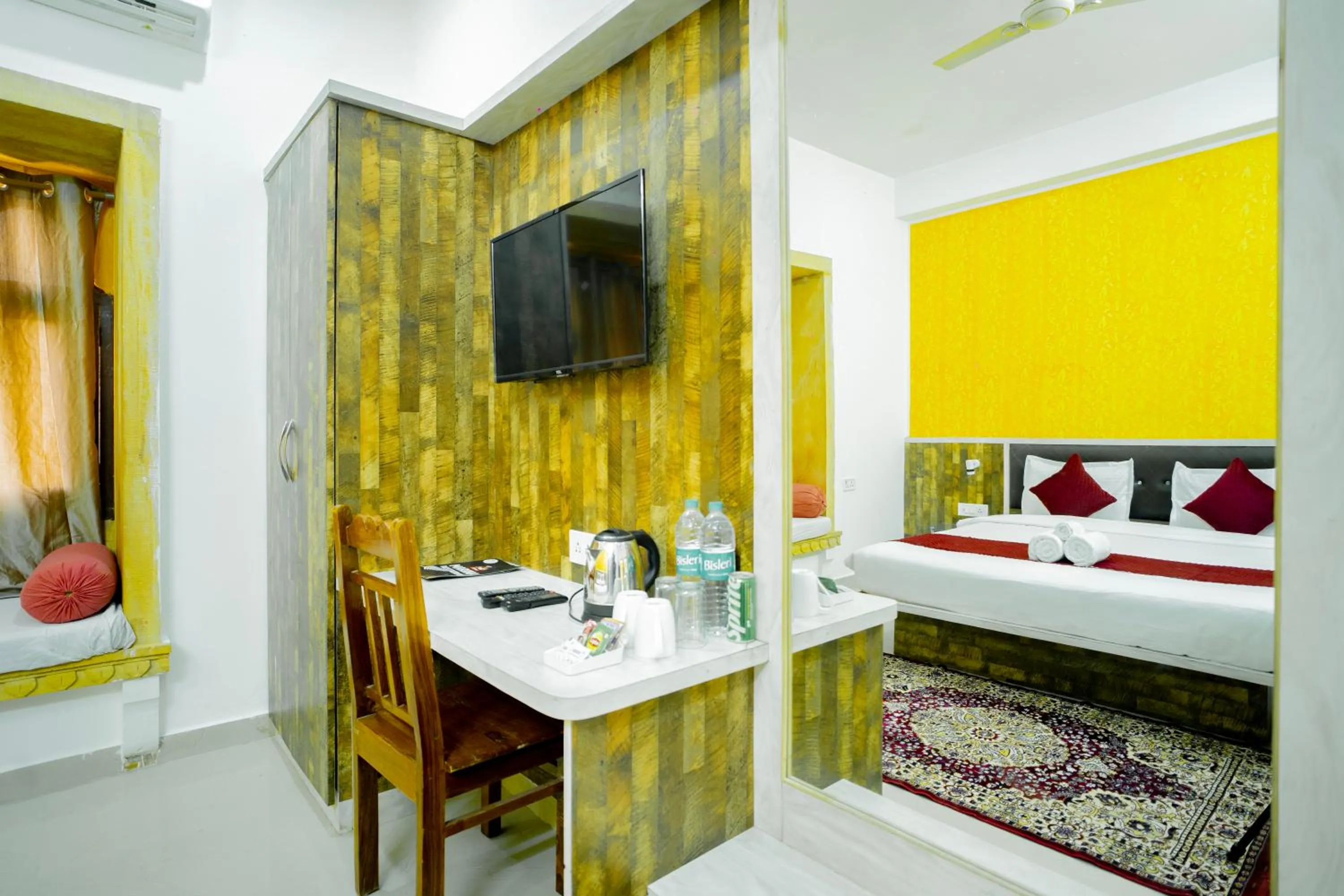 Living room, Bed in Hotel Marina Mahal with Swimming Pool