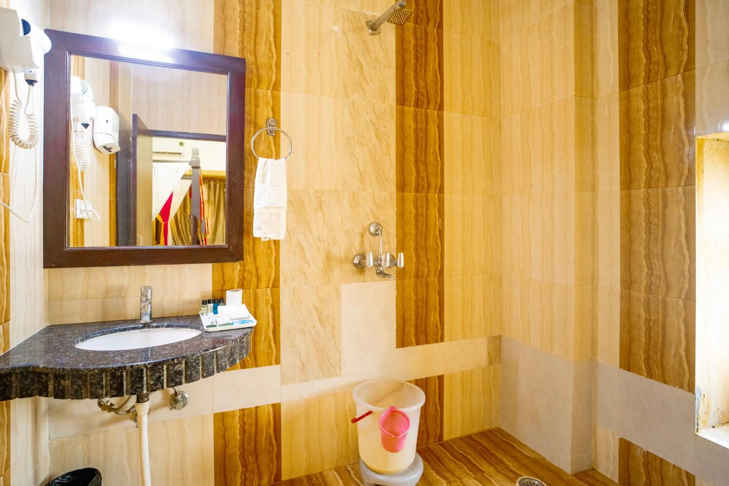 Bathroom in Hotel Marina Mahal with Swimming Pool