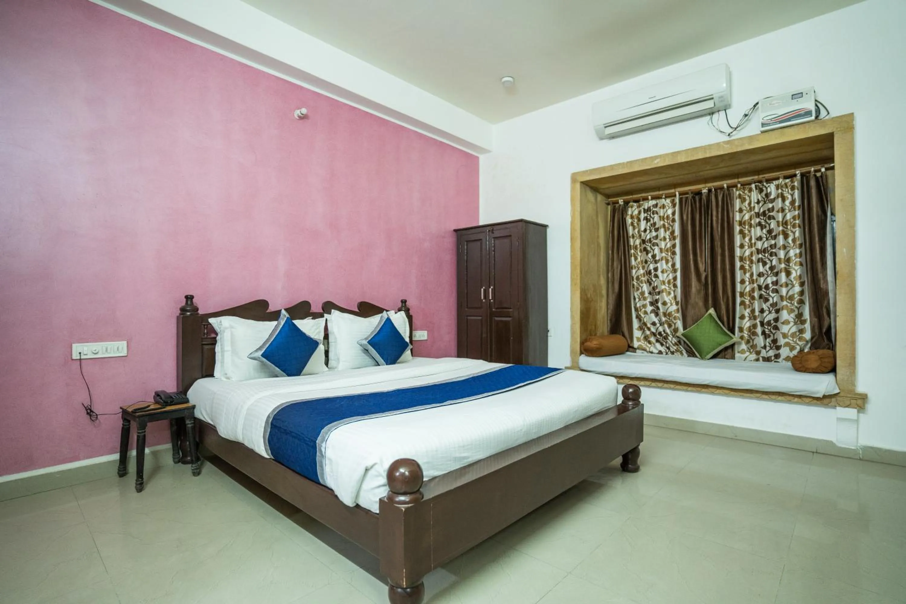 Bed in Hotel Marina Mahal with Swimming Pool
