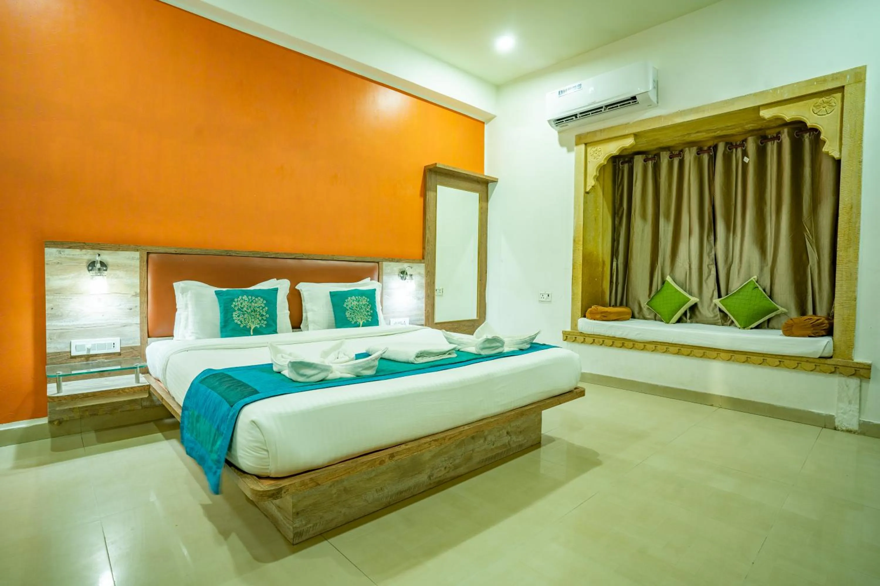 Bed in Hotel Marina Mahal with Swimming Pool