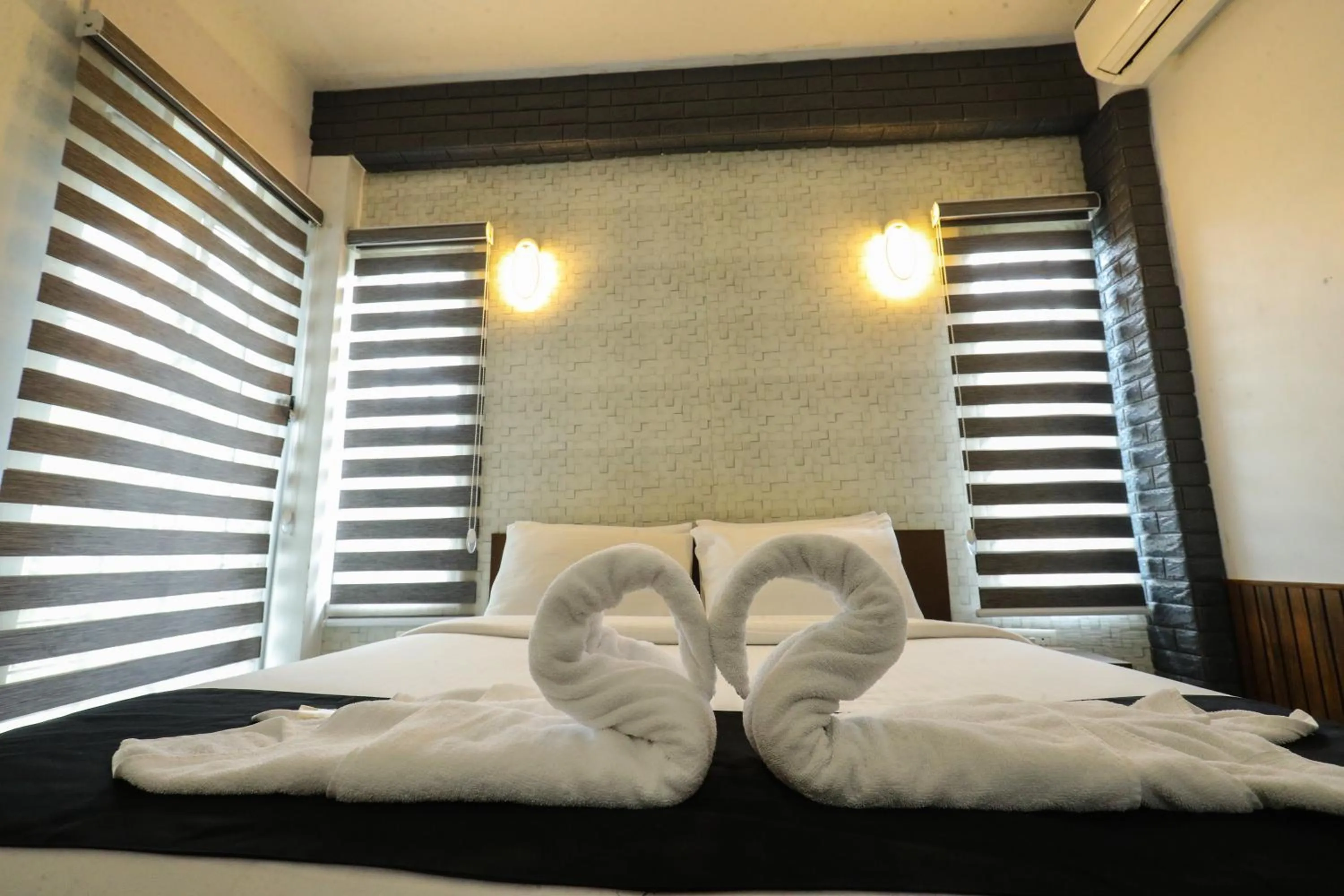 Bed in D-Green Hotels