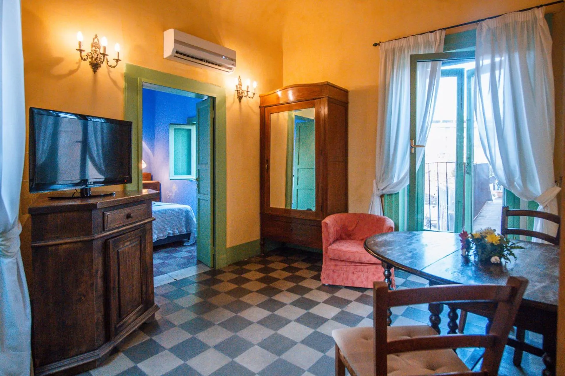 Seating area, Bed in Casa D'aria