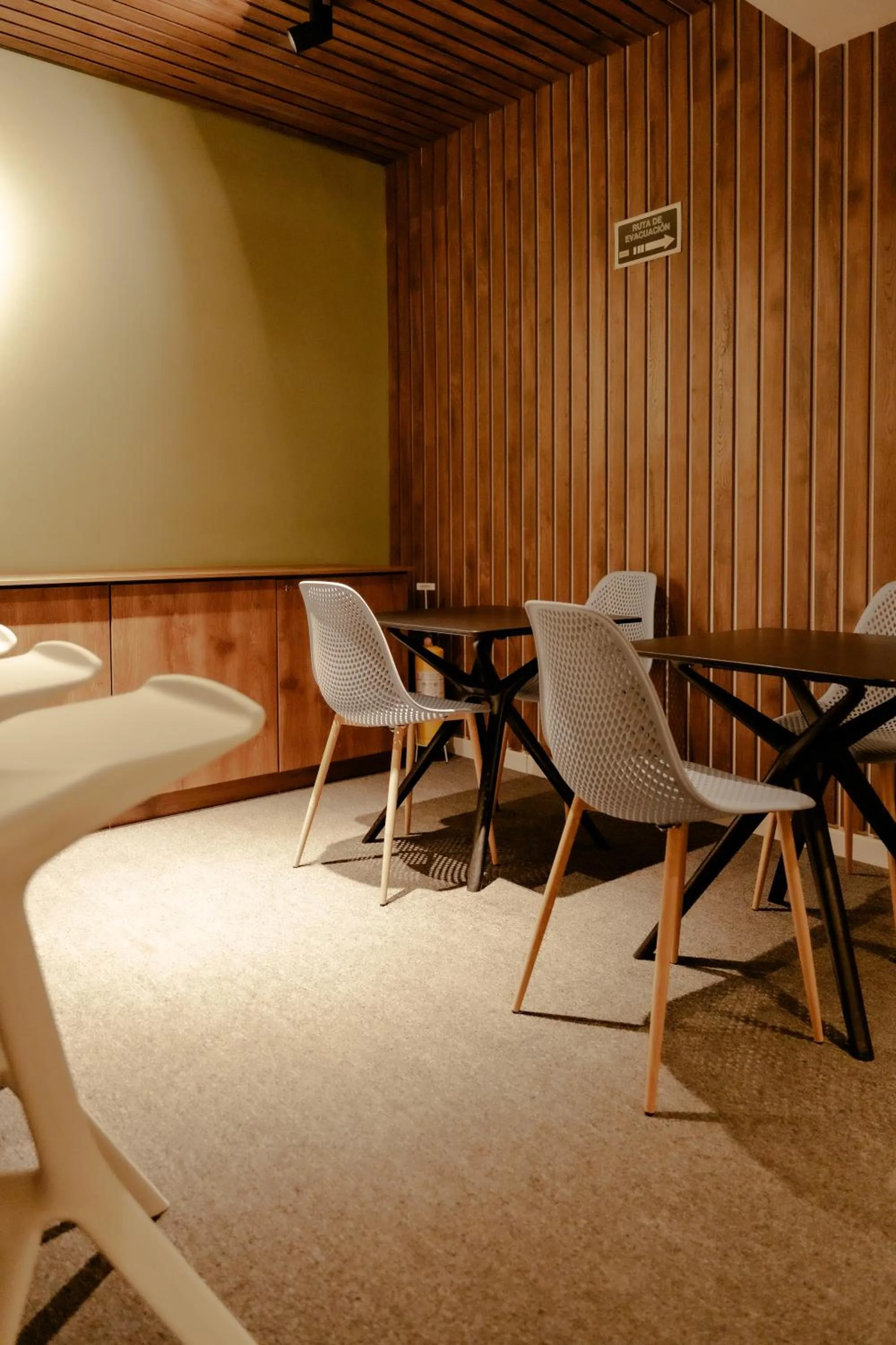 Seating area in Fence by Bernalo Hotels