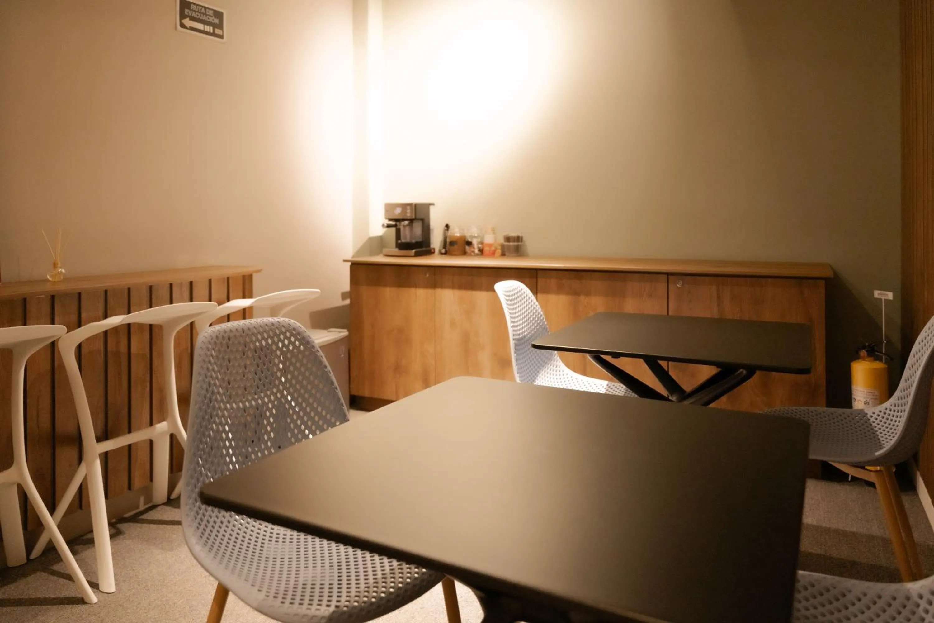 Seating area in Fence by Bernalo Hotels