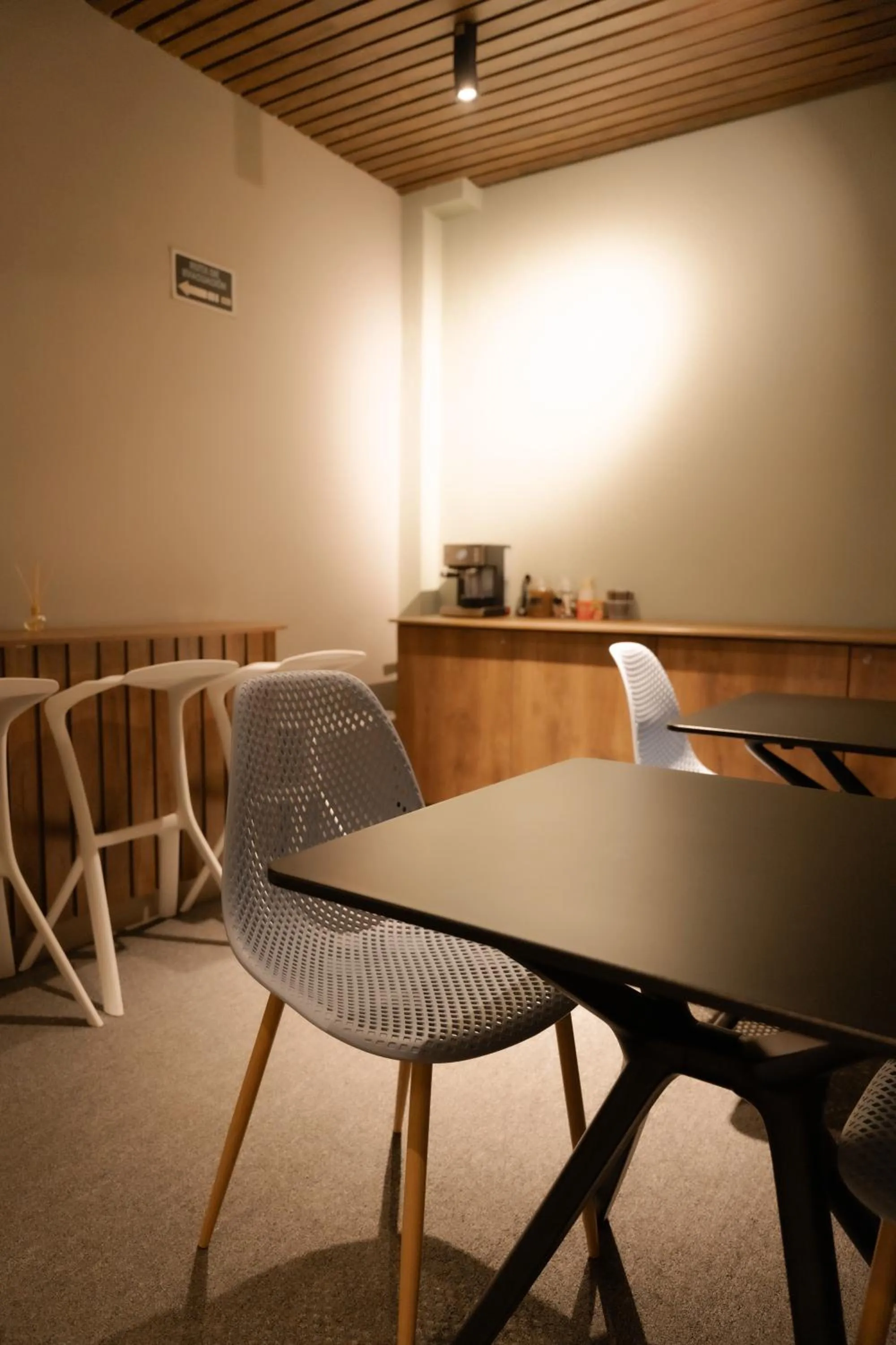 Seating area in Fence by Bernalo Hotels