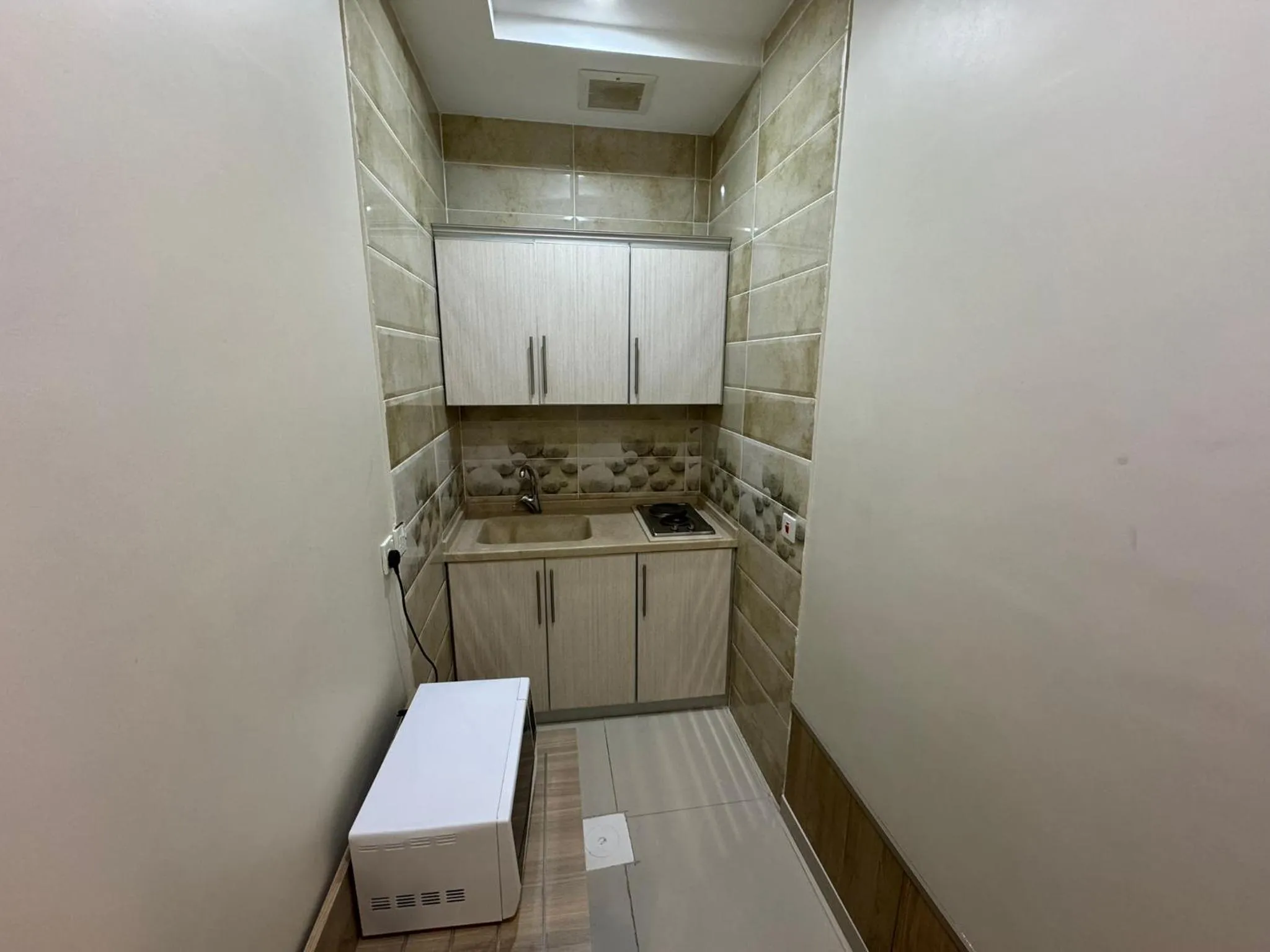 Kitchen or kitchenette in PRIMOTEL Suites As Salamah
