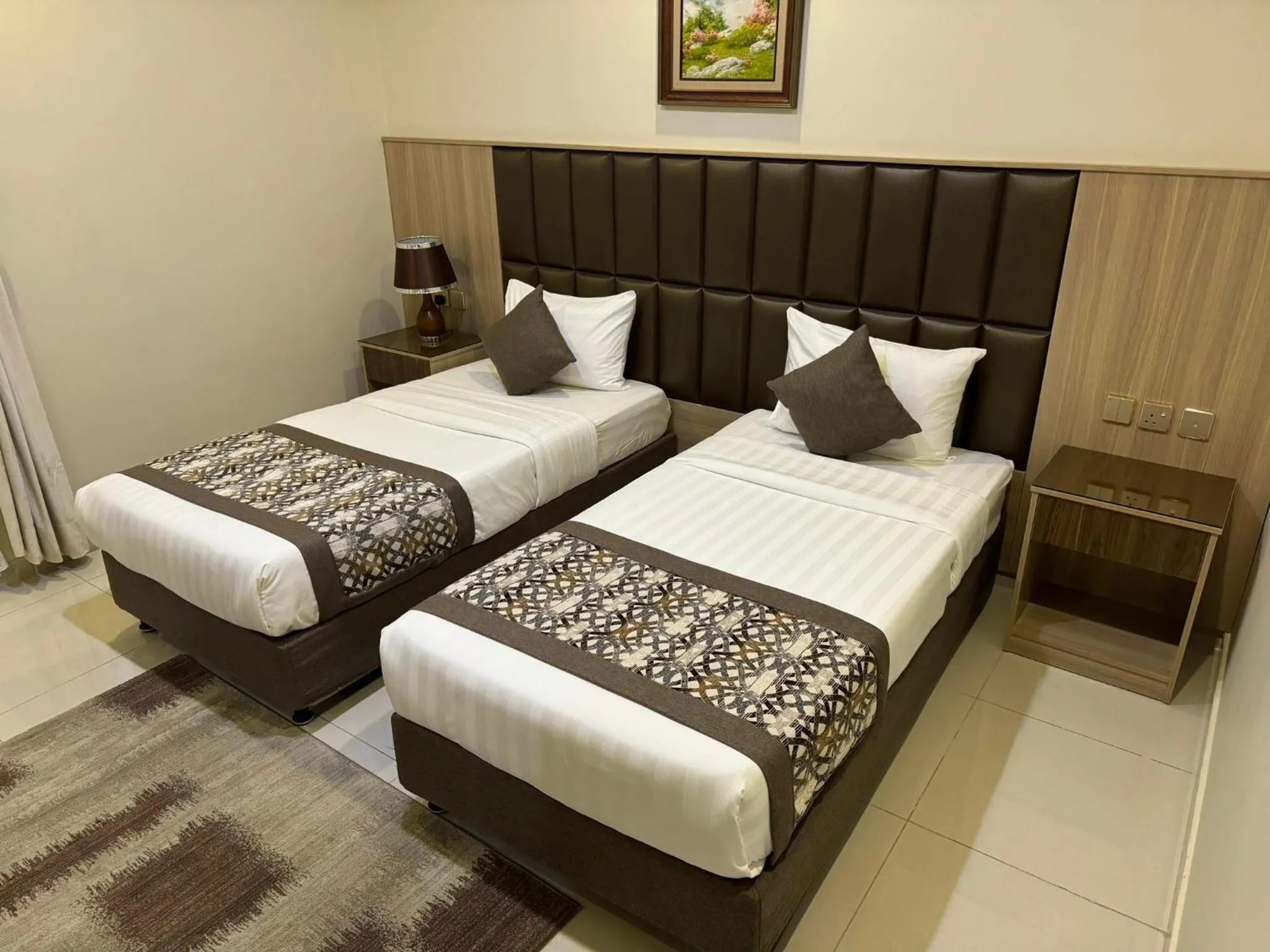 Bed in PRIMOTEL Suites As Salamah
