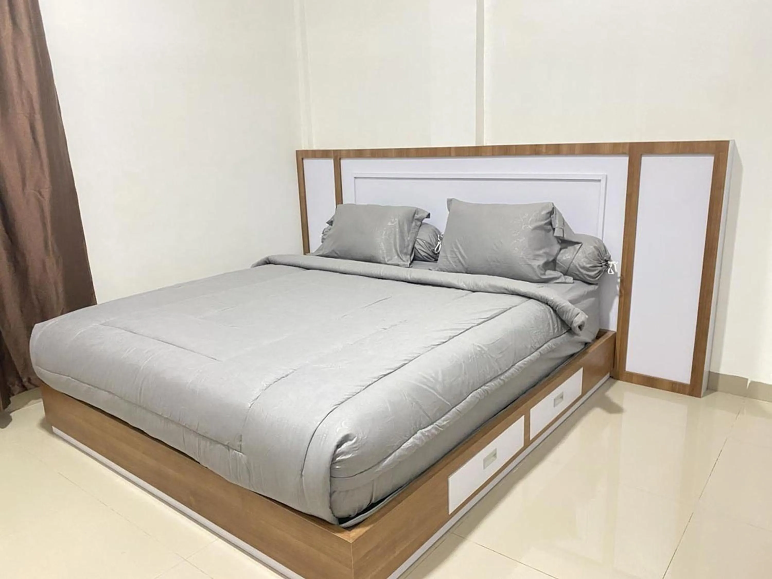 Bedroom in MJ Guest House Pusat Kota Malili Mitra RedDoorz