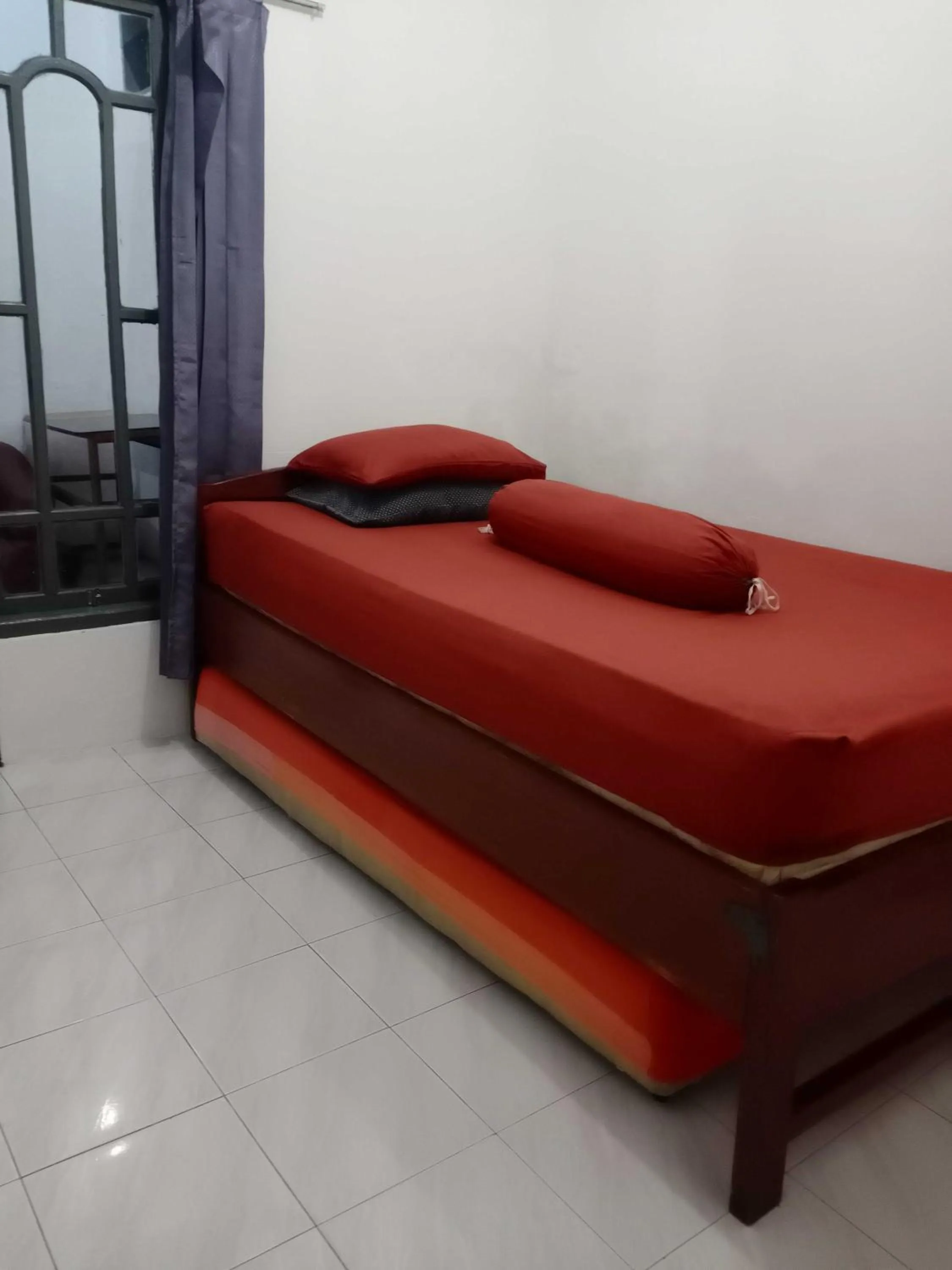 Bedroom in SPOT ON 91597 Sharie Homestay Syariah