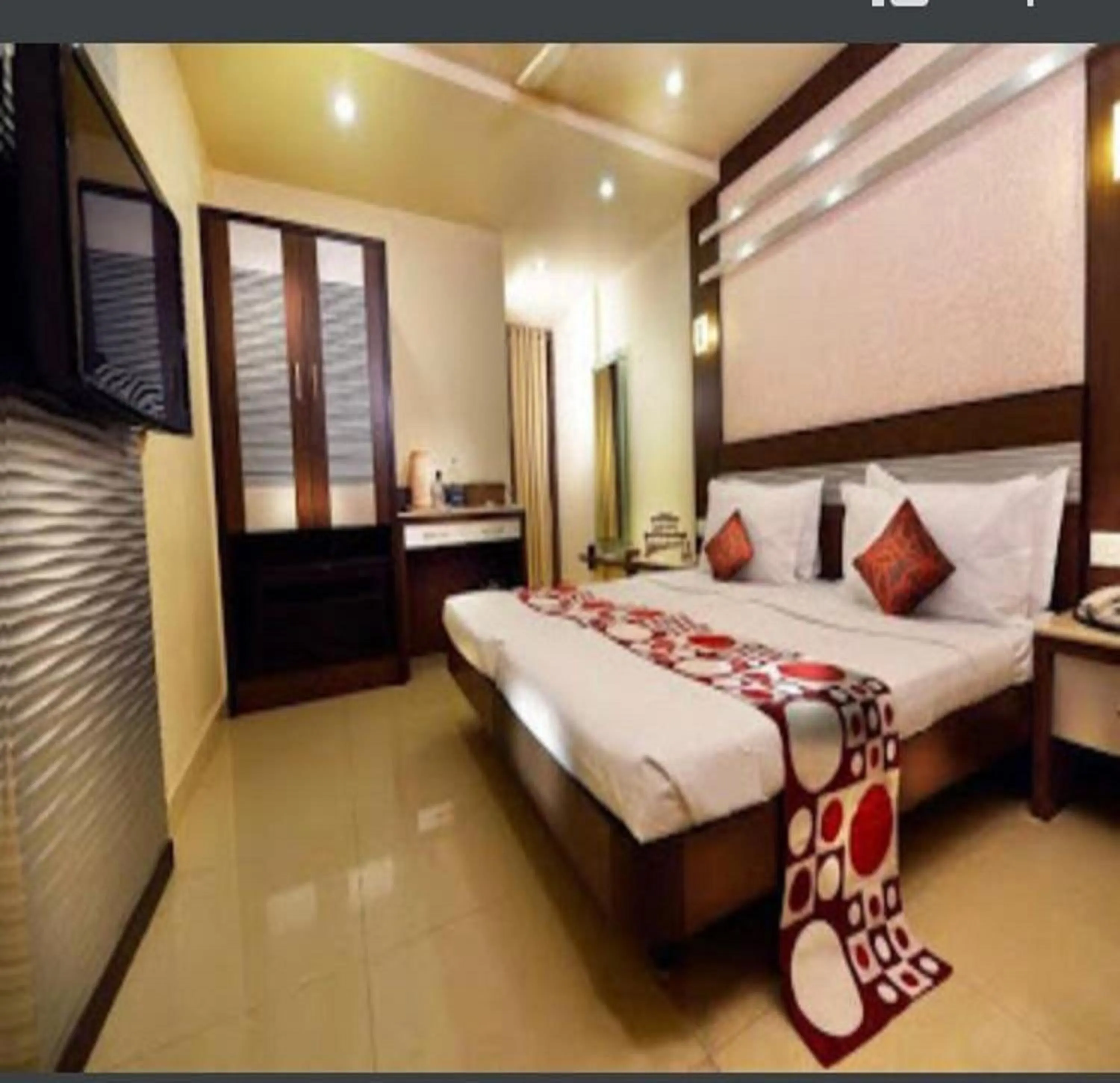 Photo of the whole room, Bed in NavaRATNA Delight