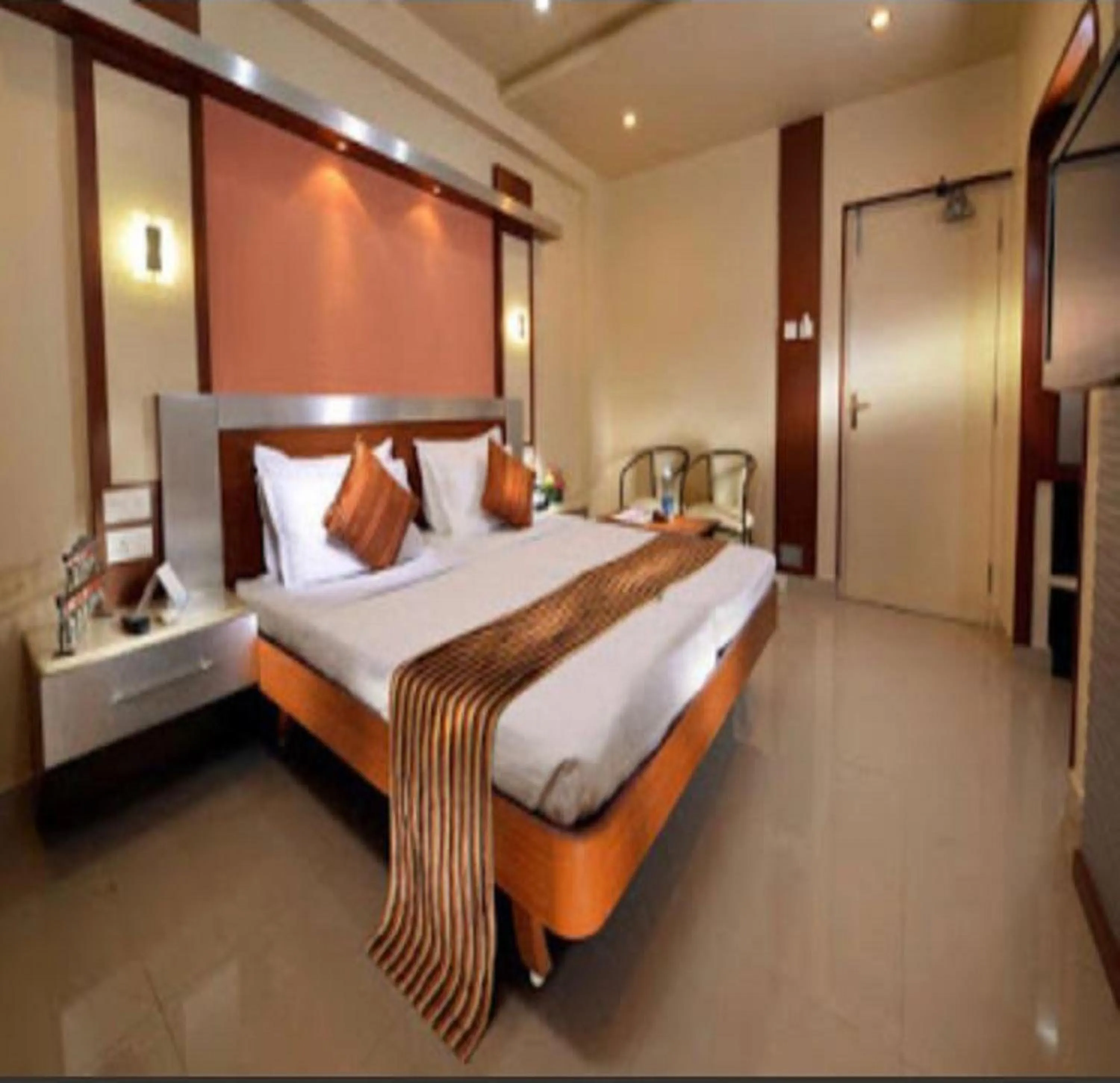 Photo of the whole room, Bed in NavaRATNA Delight