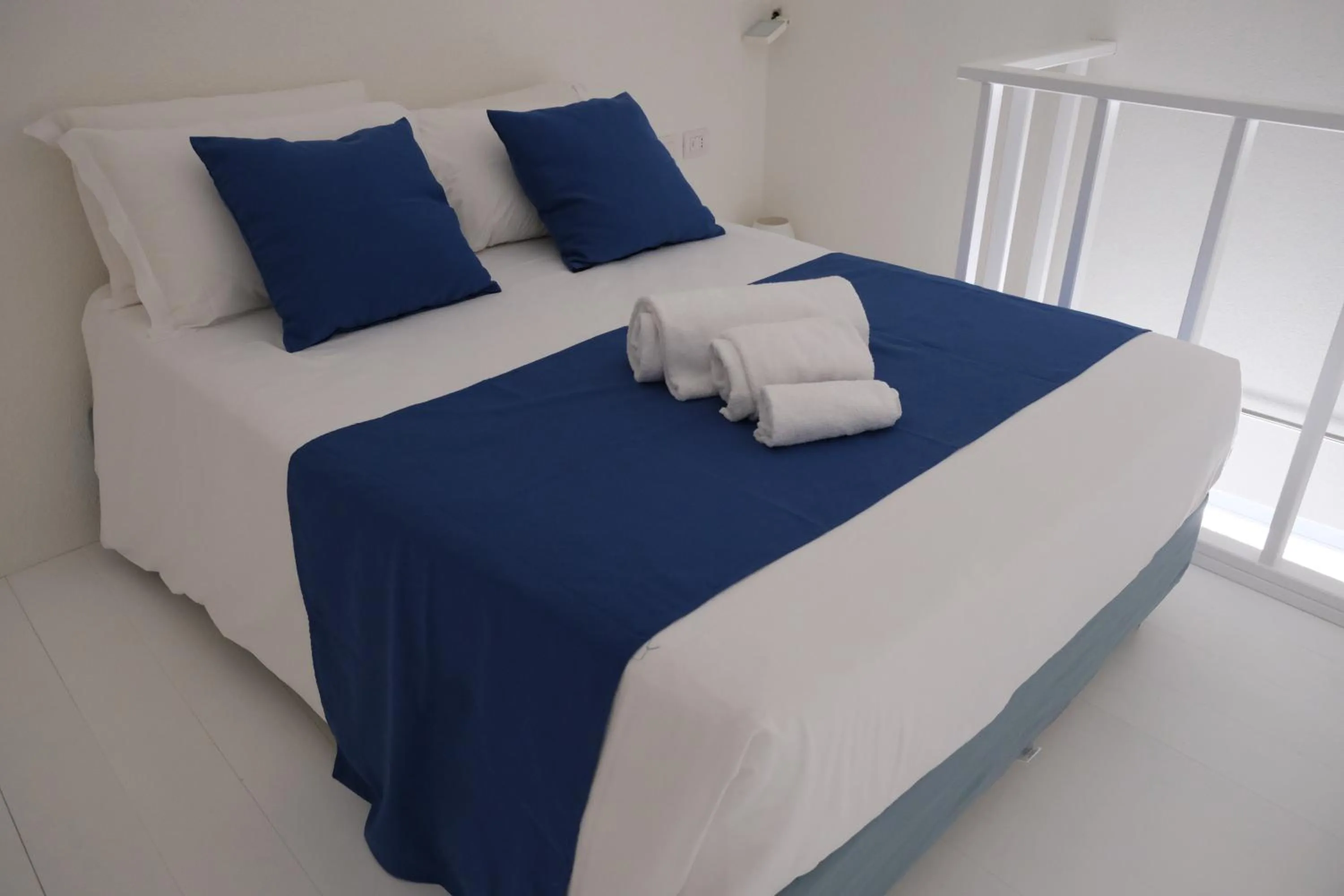 Bed in TANIT ROOMS & SPA