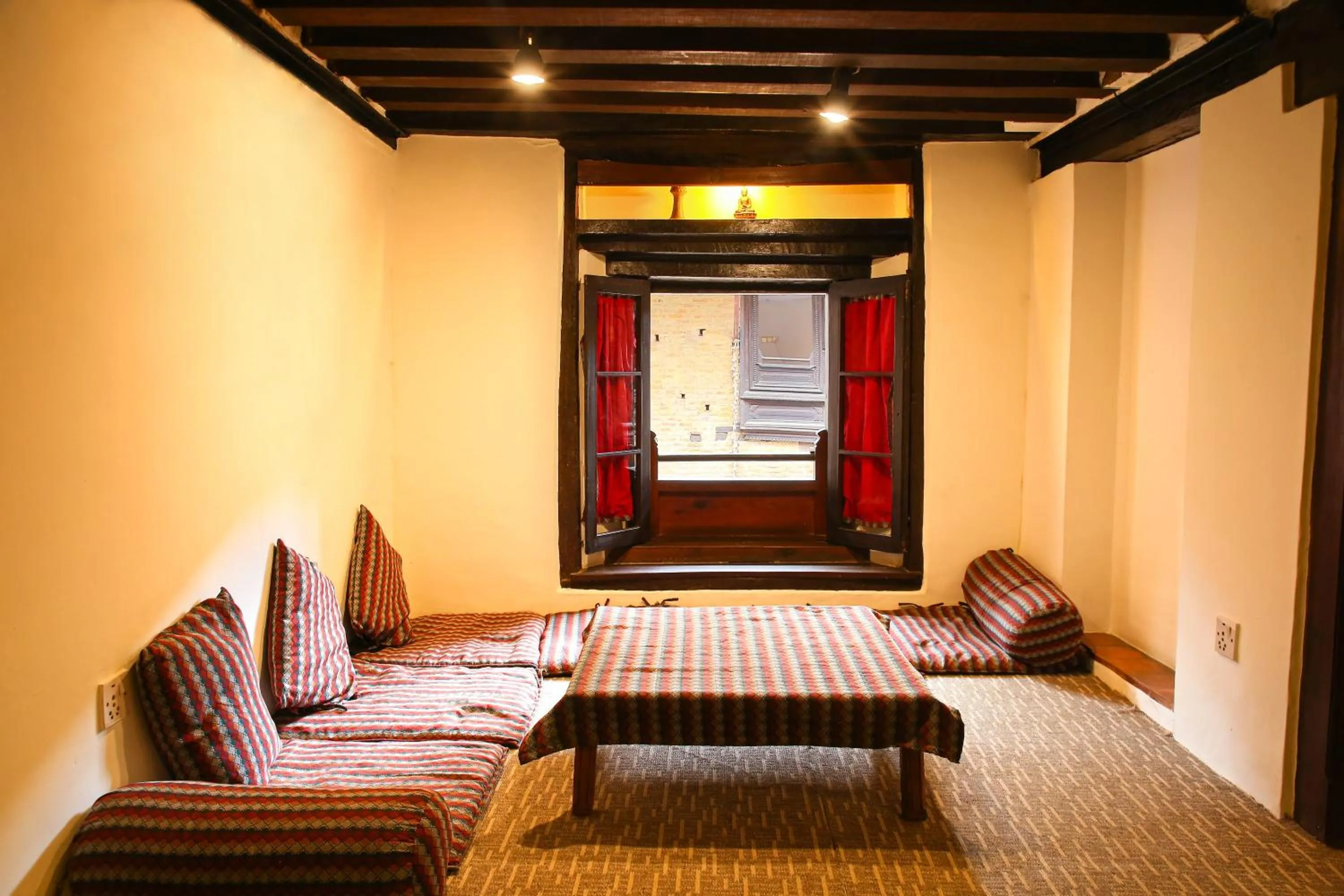 Seating area, Bed in Newa Chen Historic House UNESCO