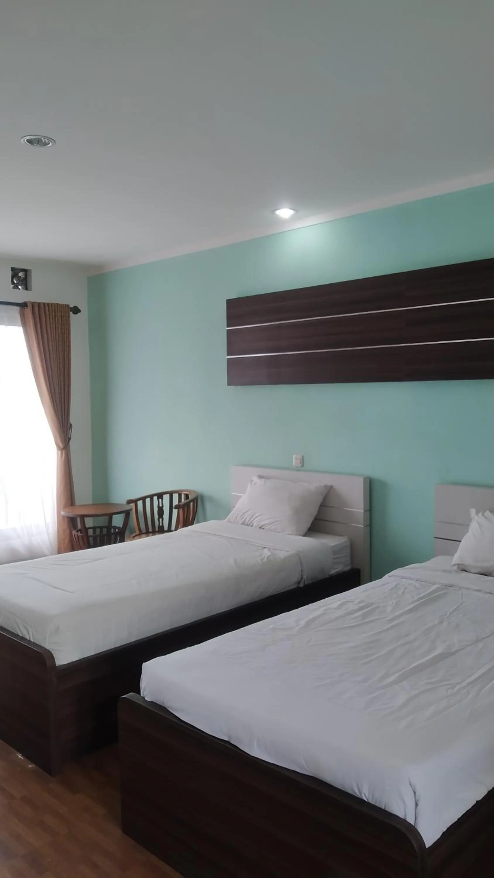 Bed in PUNCAK VILLAGE HOTEL & KAMPUNG MAIN ANAK