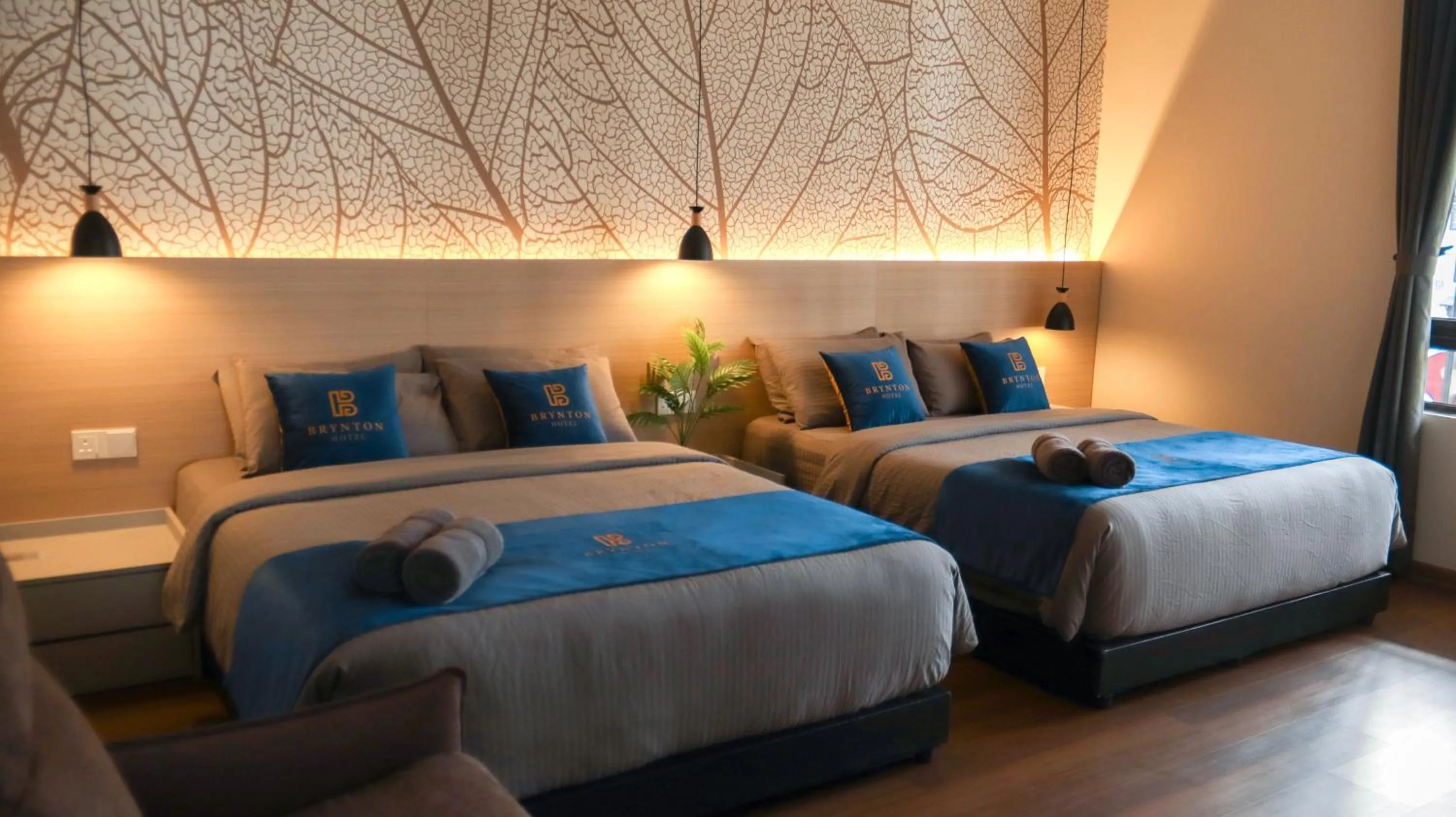 Bed in Hotel Brynton at Cameron Centrum Mall