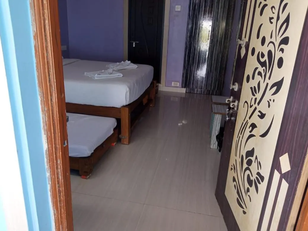 Bed in Poornima Beach Stay