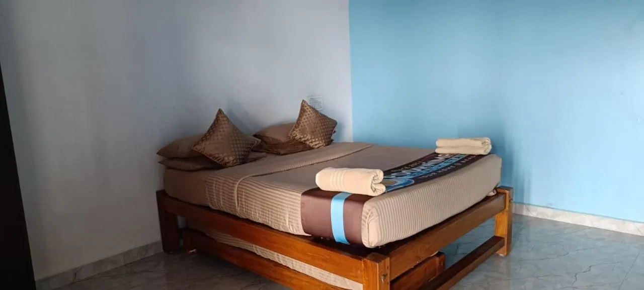 Bed in Poornima Beach Stay