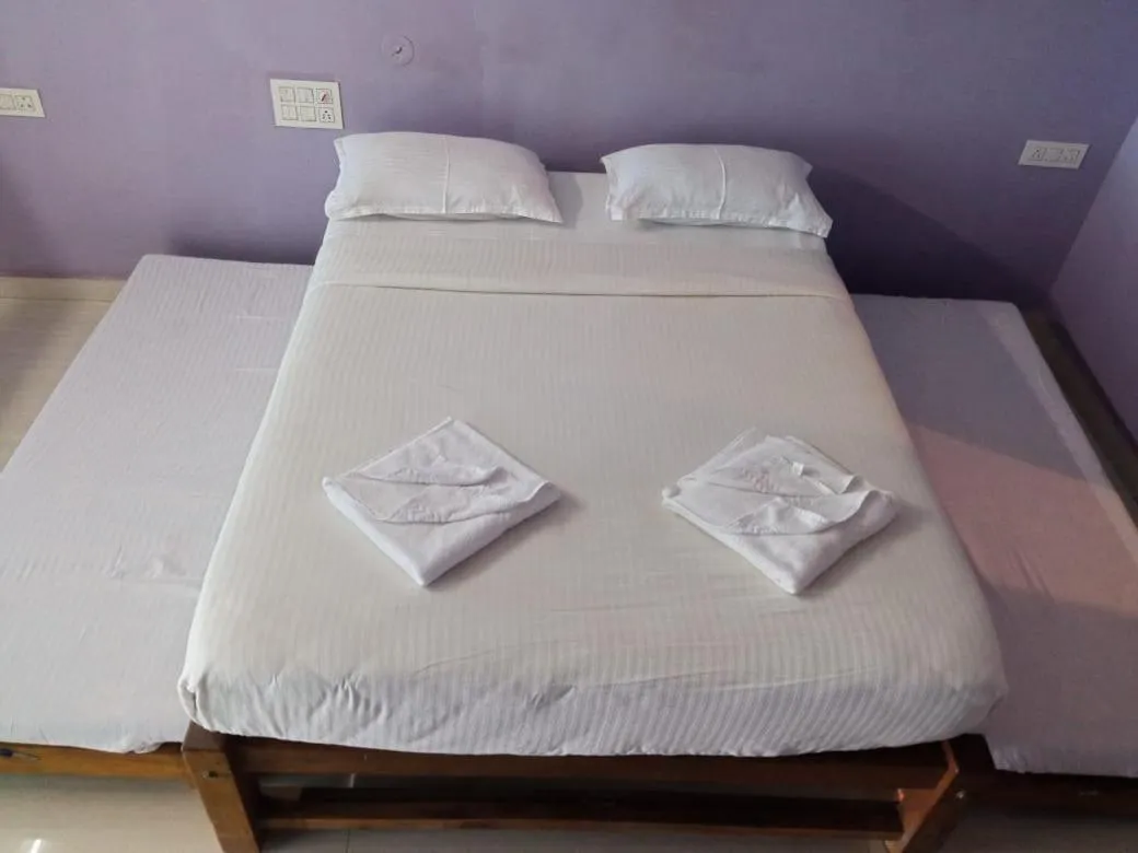 Bed in Poornima Beach Stay