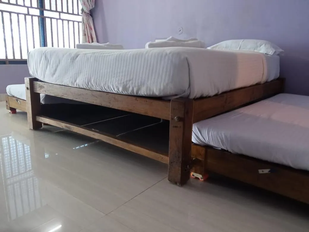 Bed in Poornima Beach Stay
