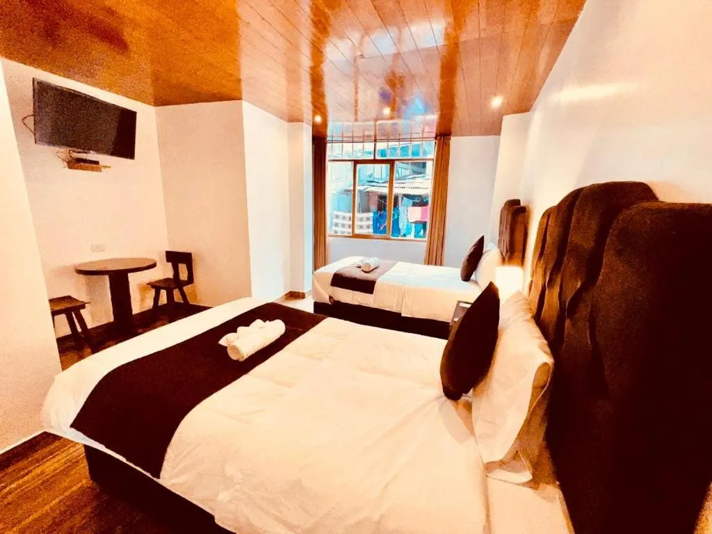 Bed in SAYACMARCA CLASSIC Inn