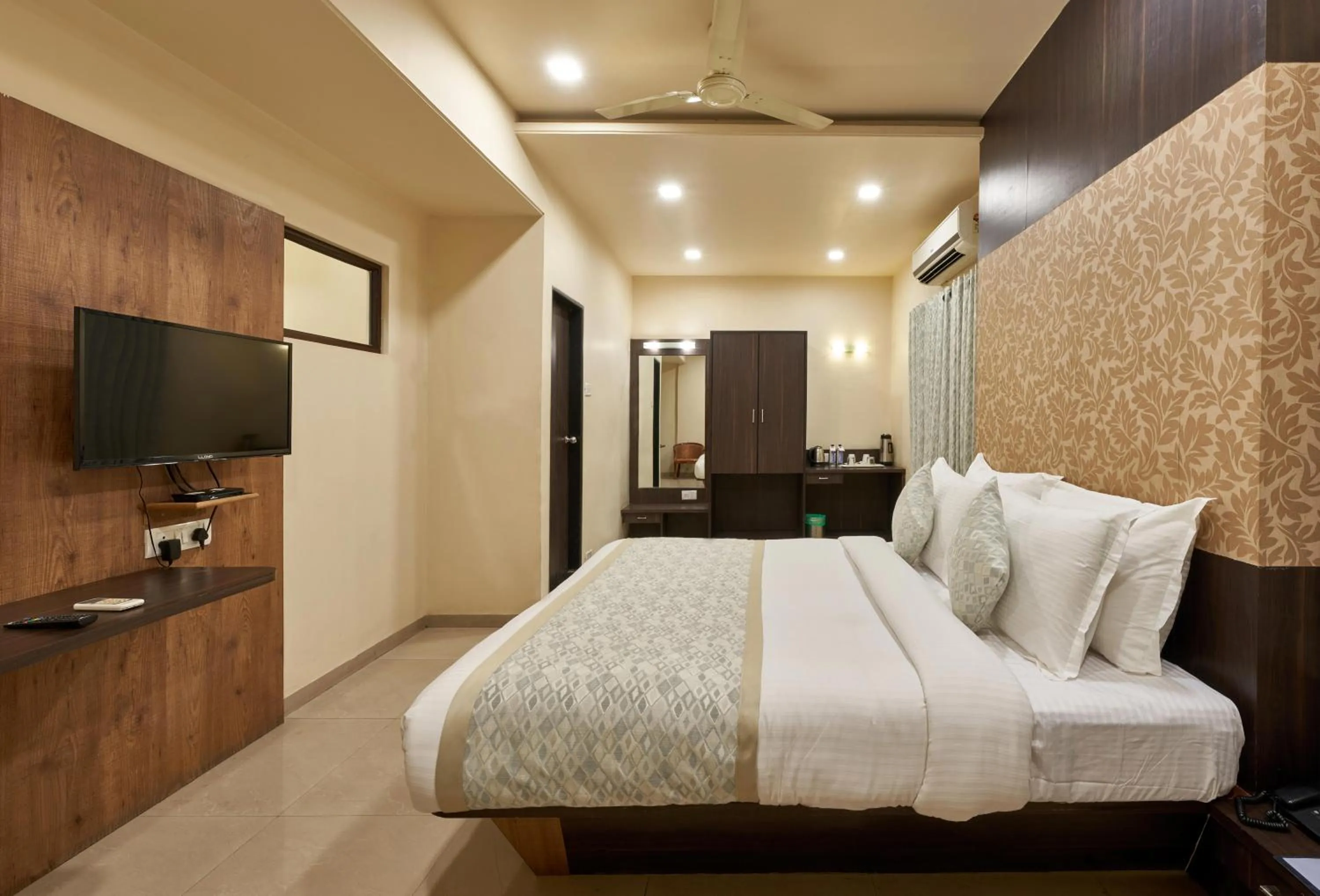 Photo of the whole room, Bed in Hotel Atria, Kolhapur