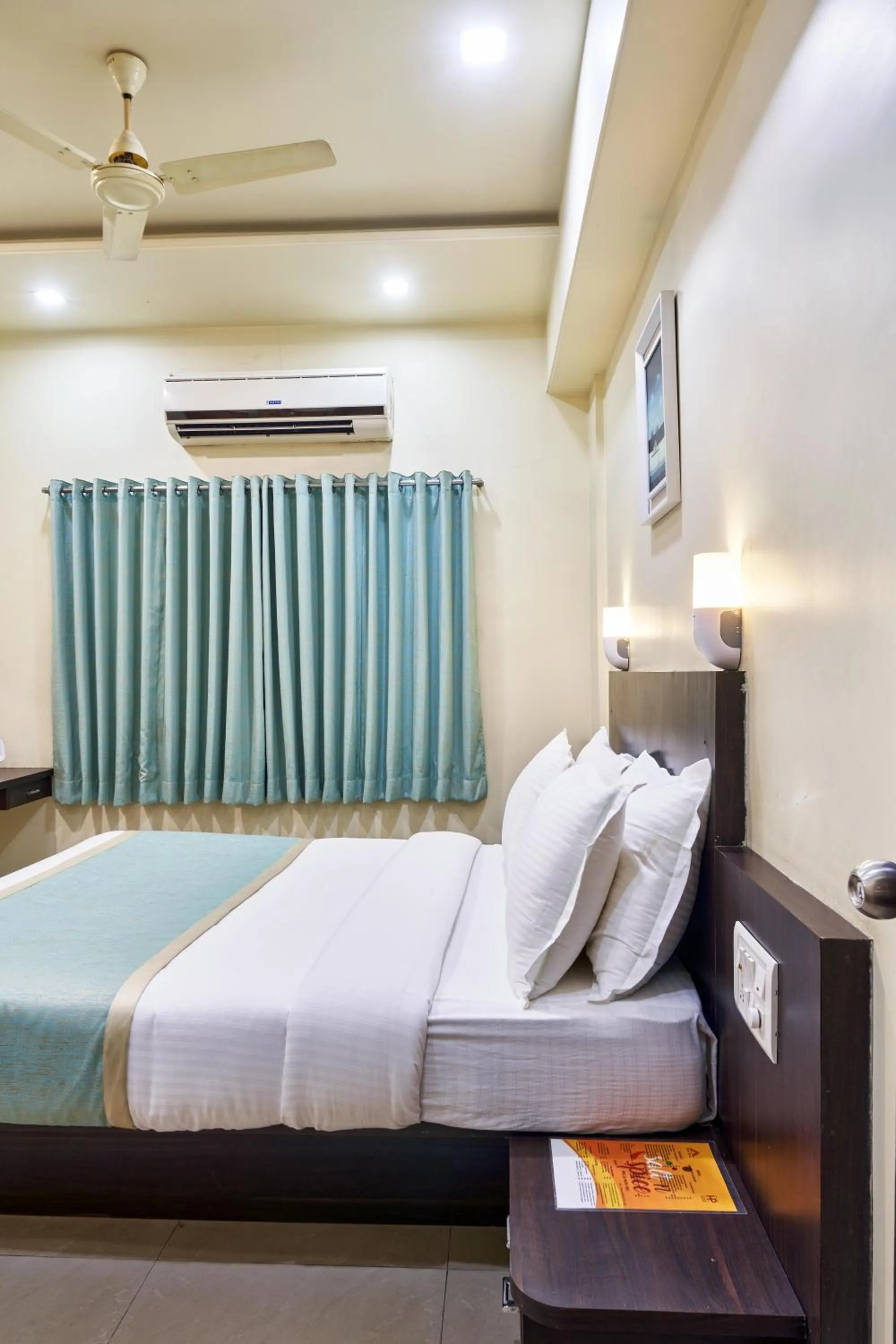 Photo of the whole room, Bed in Hotel Atria, Kolhapur