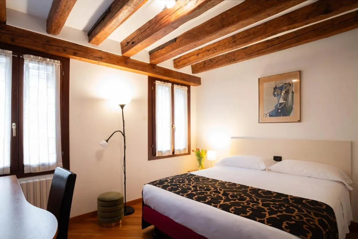 Bed in Salmaso Apartments