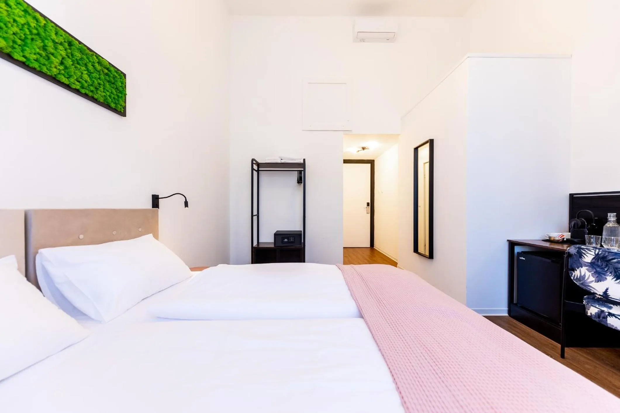 Bed in Adagio Downtown Rooms