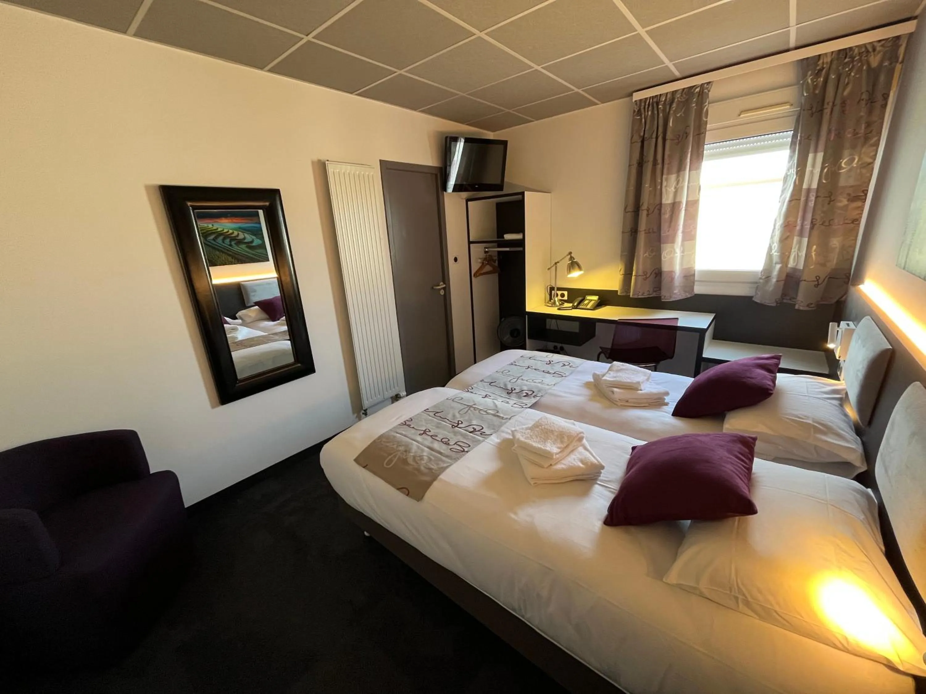 Photo of the whole room, Bed in BRIT HOTEL LE VESOUL